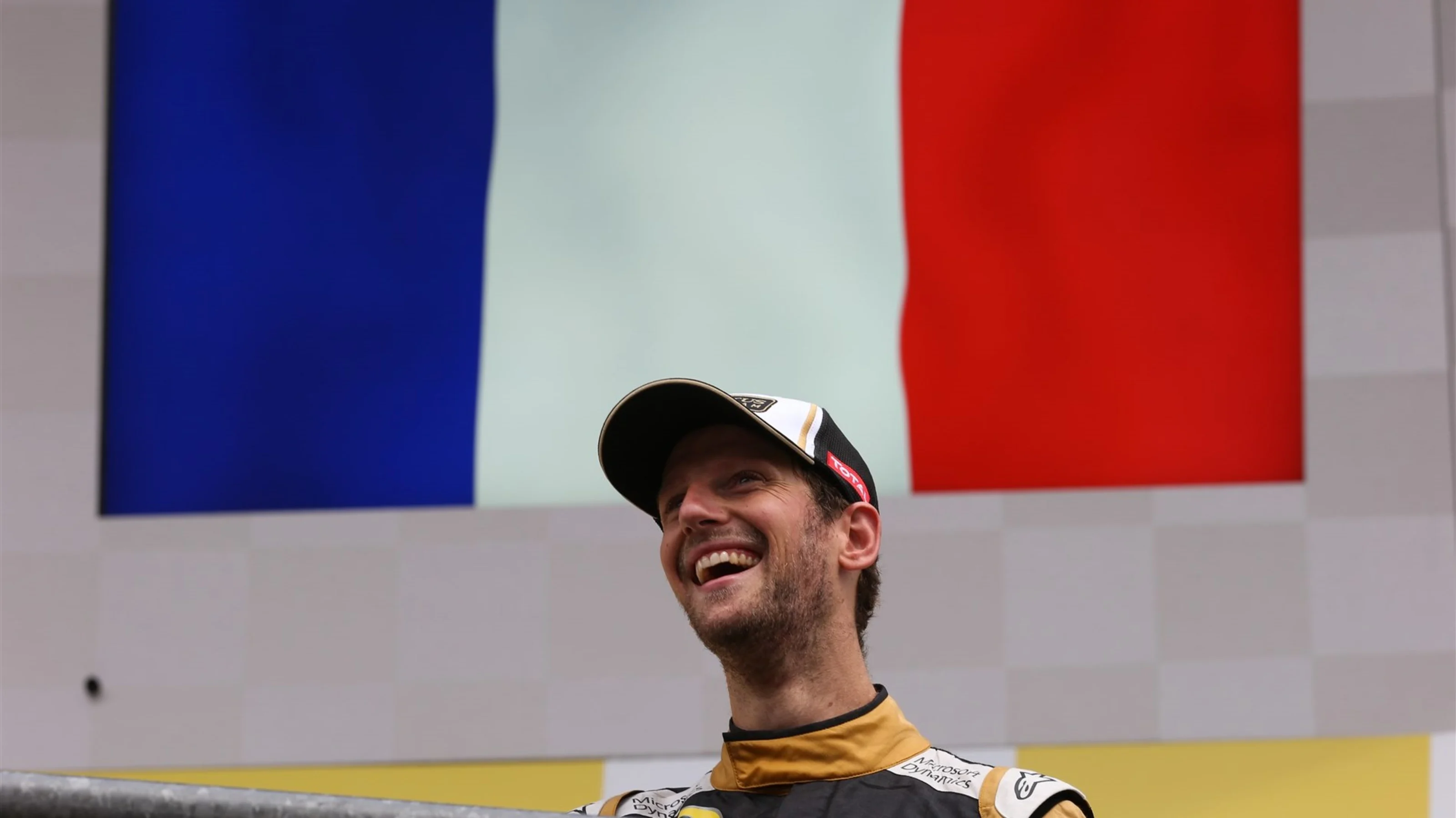 Romain Grosjean (FRA) Lotus F1 celebrates on the podium at Formula One World Championship, Rd11,