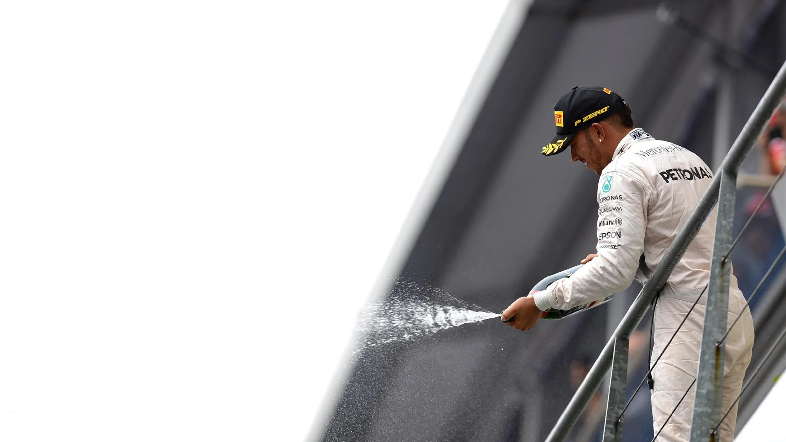 Race winner Lewis Hamilton (GBR) Mercedes AMG F1 celebrates with the champagne on the podium at