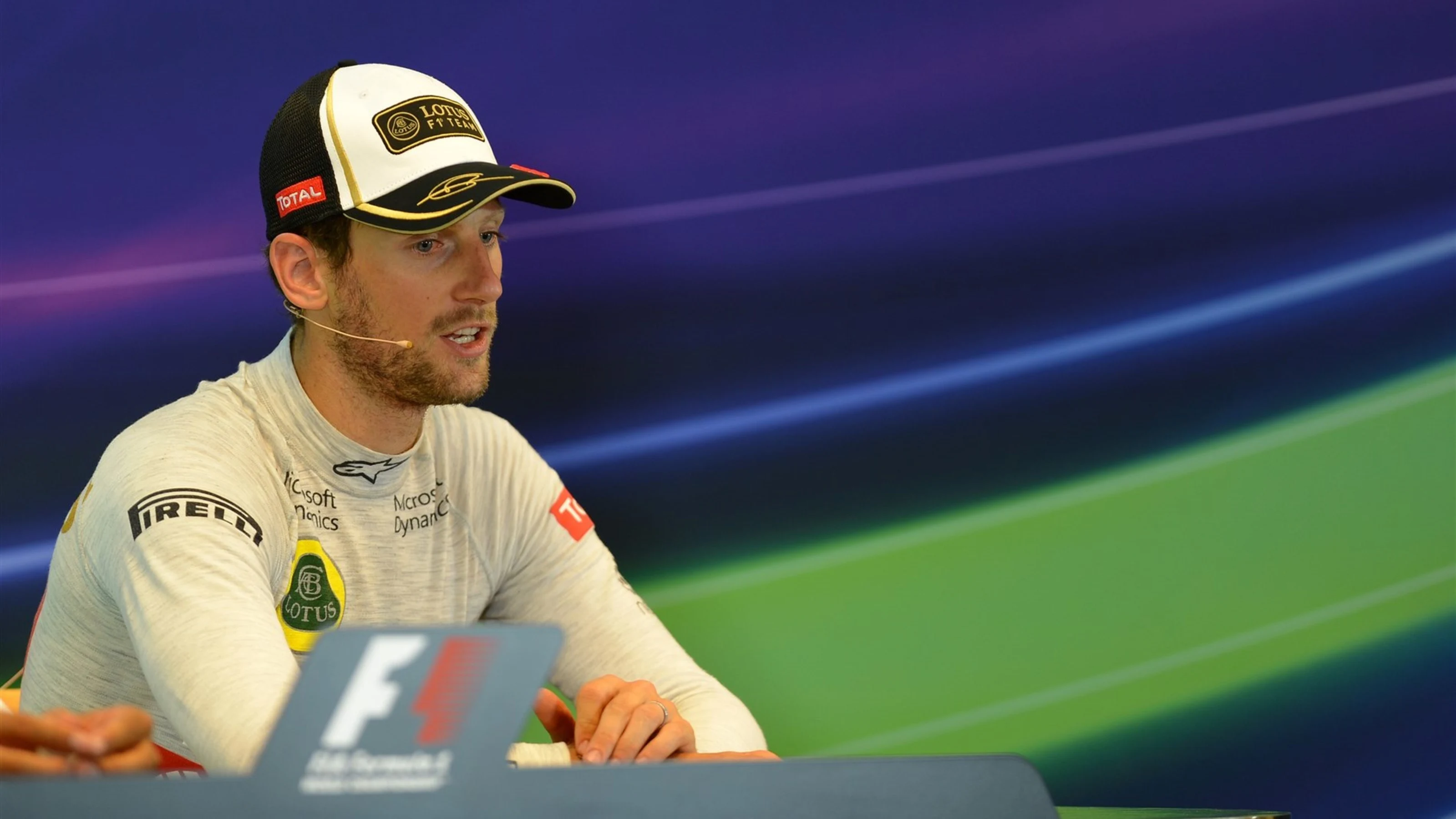 Romain Grosjean (FRA) Lotus F1 in the Press Conference at Formula One World Championship, Rd11,