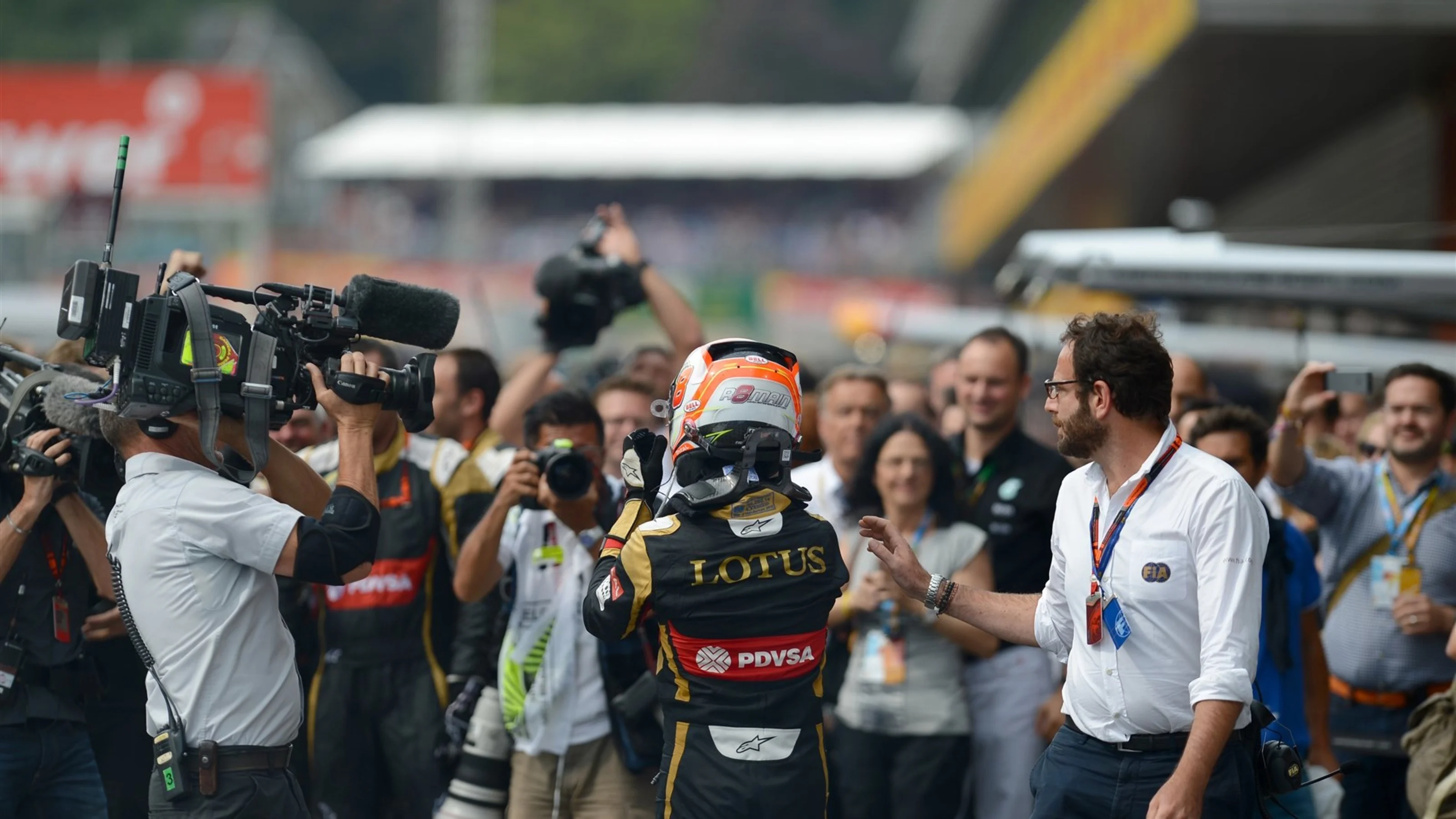 Romain Grosjean (FRA) Lotus F1 in celebrates in parc ferme at Formula One World Championship, Rd11,