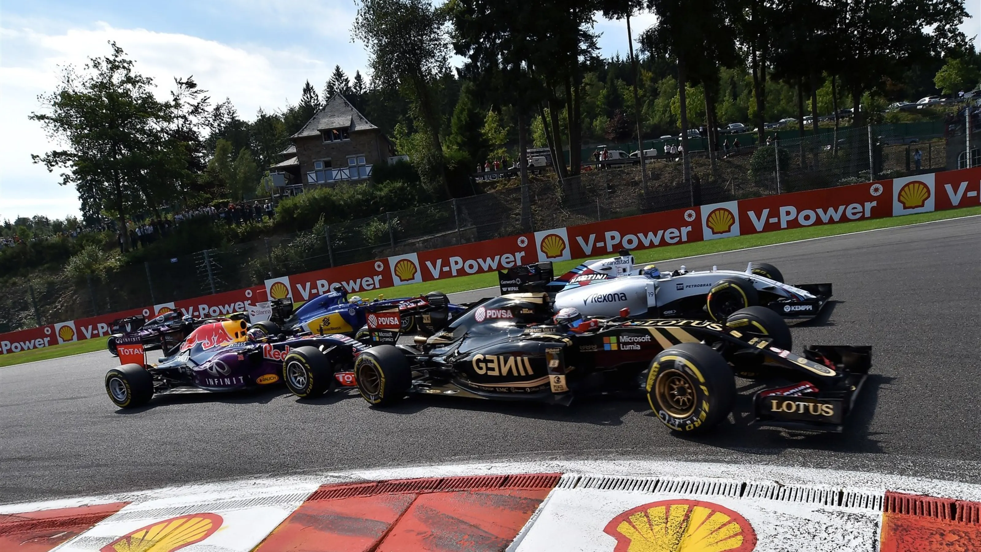 Romain Grosjean (FRA) Lotus E23 Hybrid and Felipe Massa (BRA) Williams FW37 at the start of the