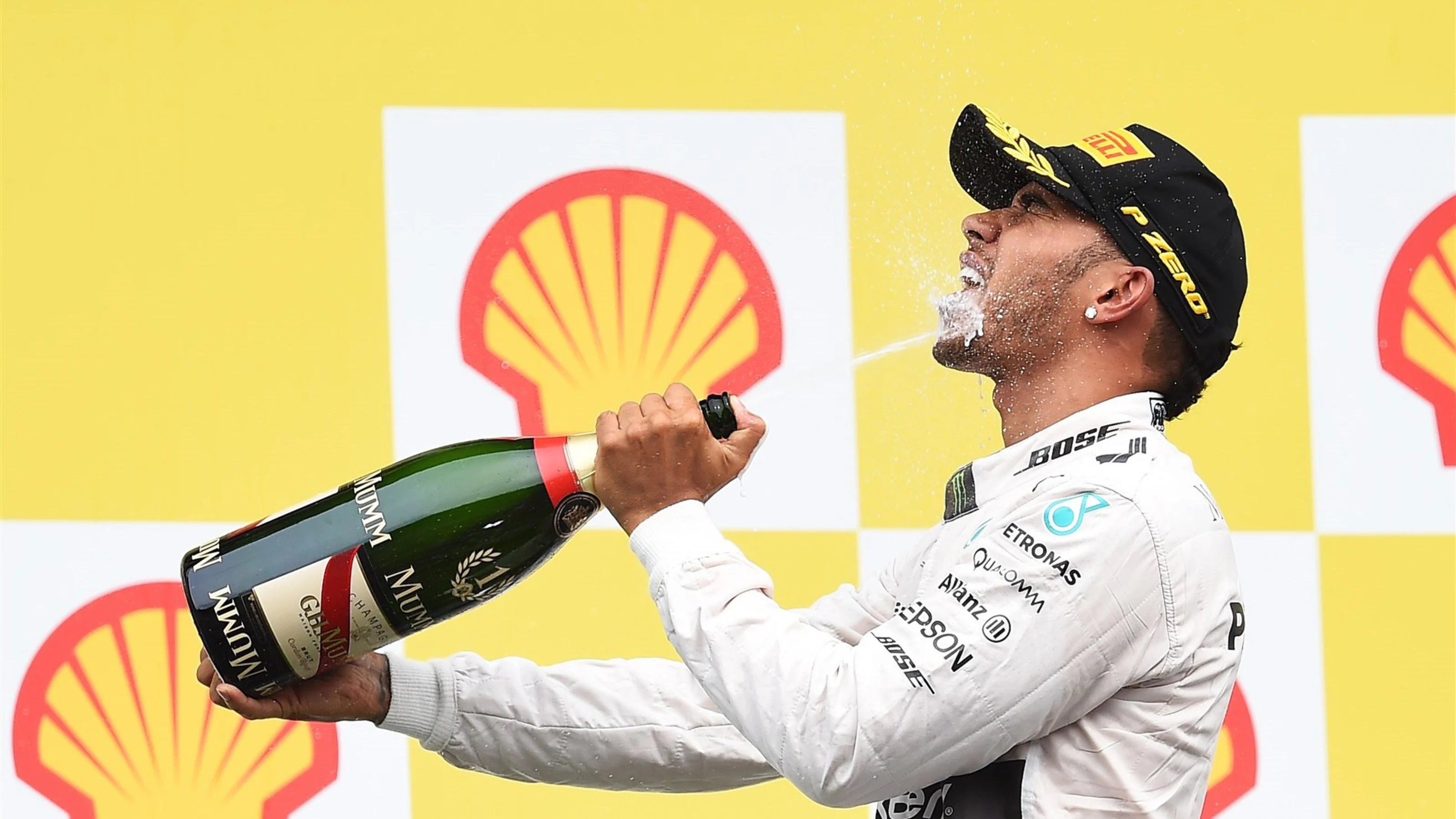 Race winner Lewis Hamilton (GBR) Mercedes AMG F1 celebrates on the podium with the champagne at