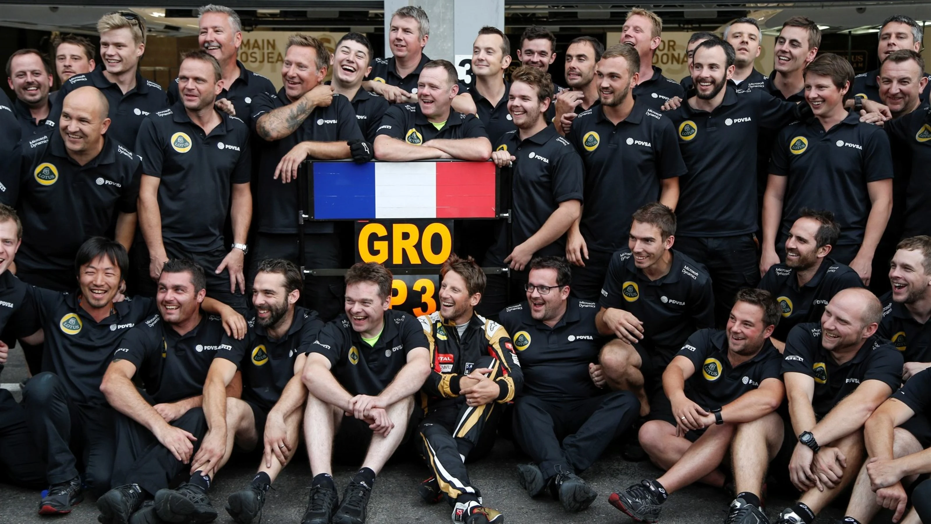 Thrid placed Romain Grosjean (FRA) Lotus celebrates with the team at Formula One World