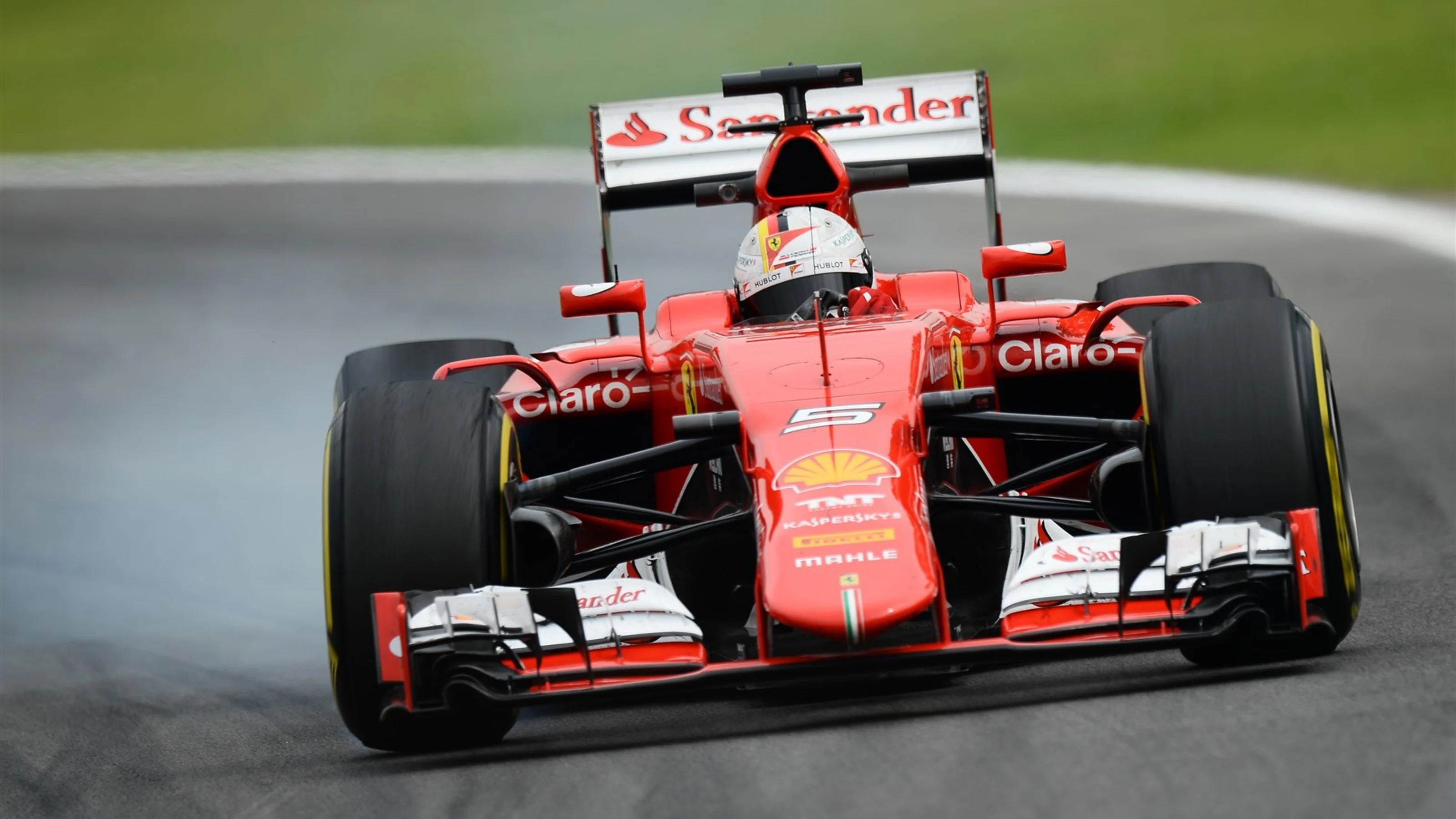 Sebastian Vettel (GER) Ferrari SF15-T lock up at Formula One World Championship, Rd18, Brazilian