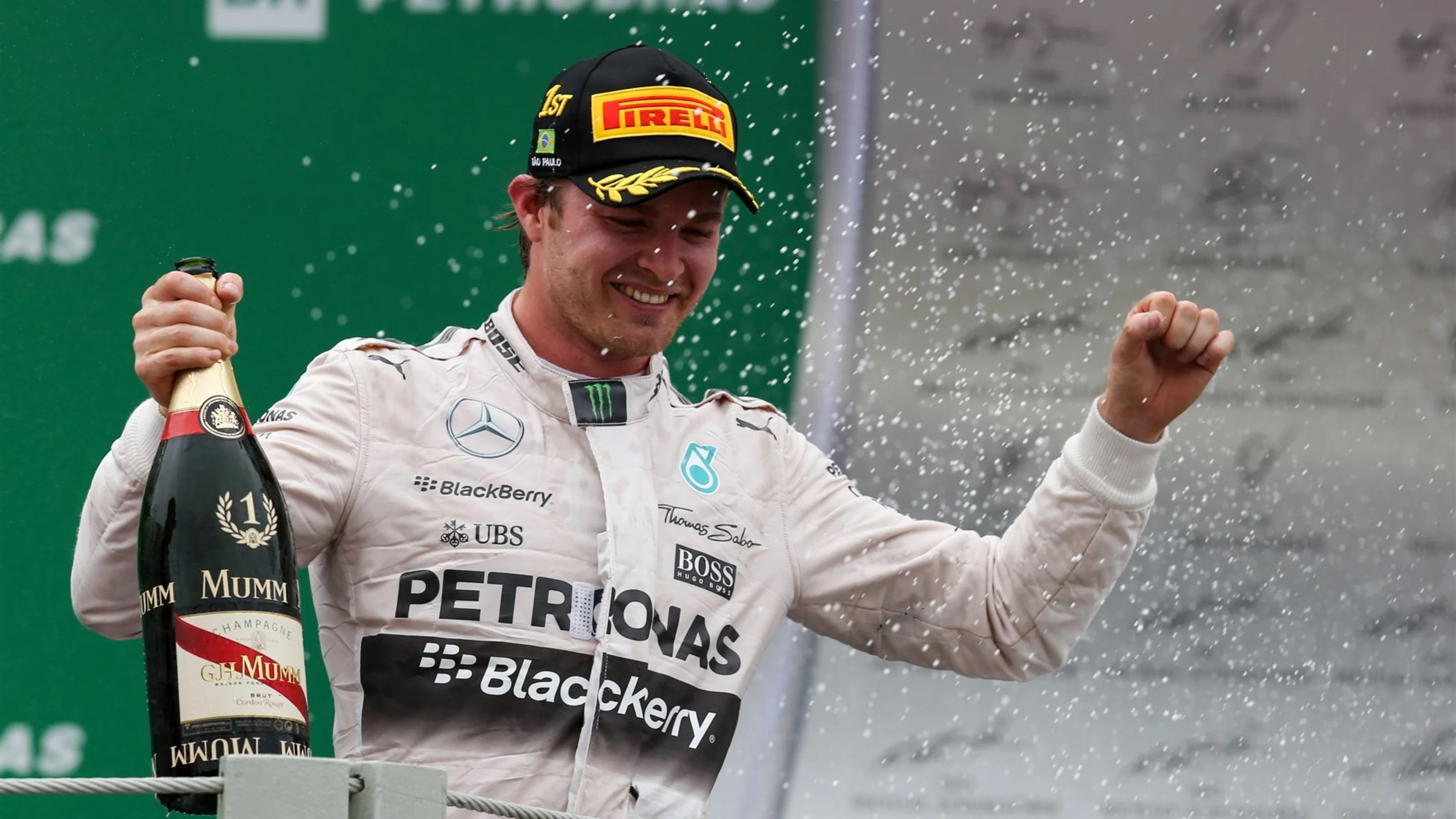 Race winner Nico Rosberg (GER) Mercedes AMG F1 celebrates with the champagne on the podium at