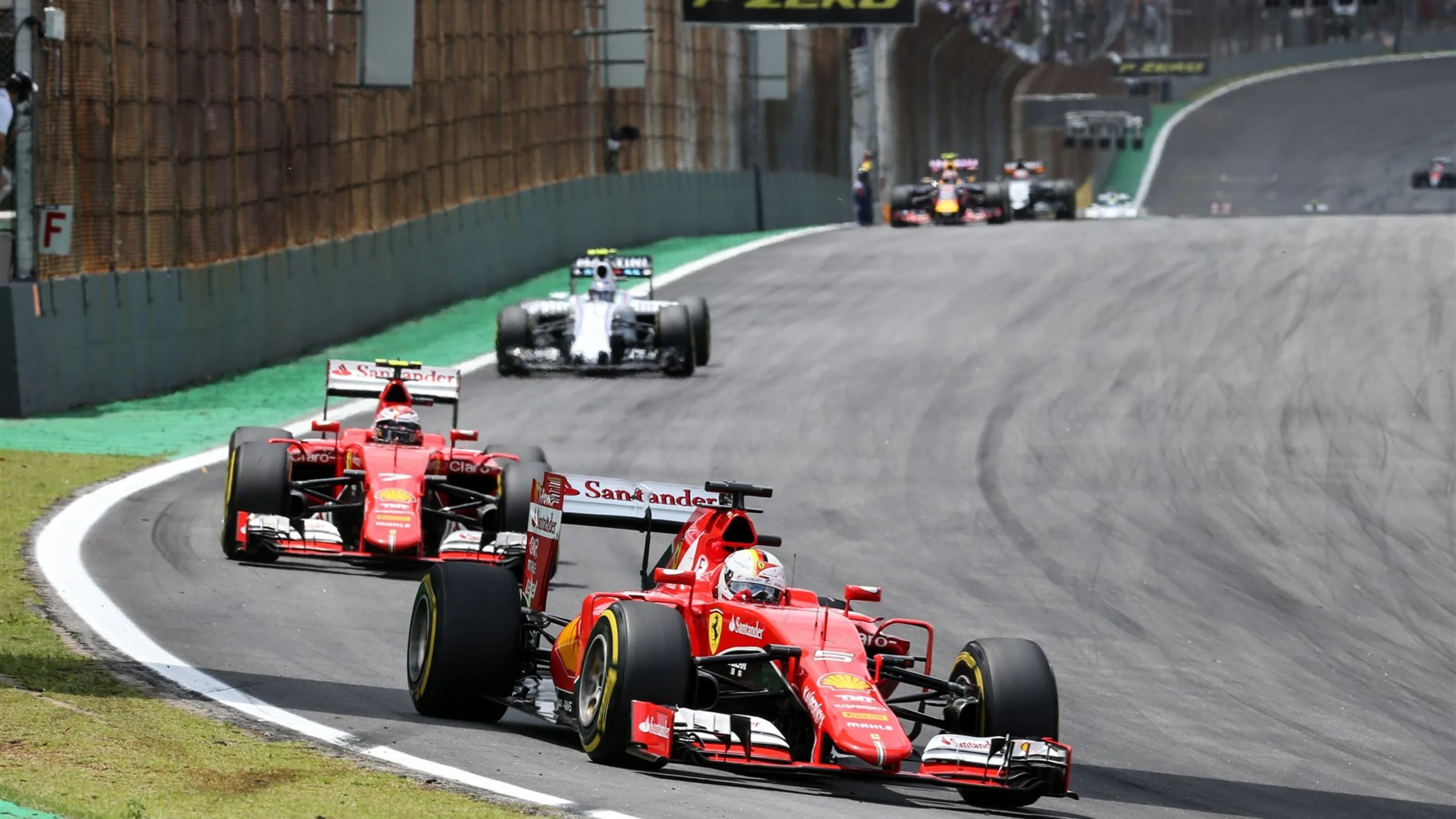 Sebastian Vettel (GER) Ferrari SF15-T ahead Kimi Raikkonen (FIN) Ferrari SF15-T at Formula One