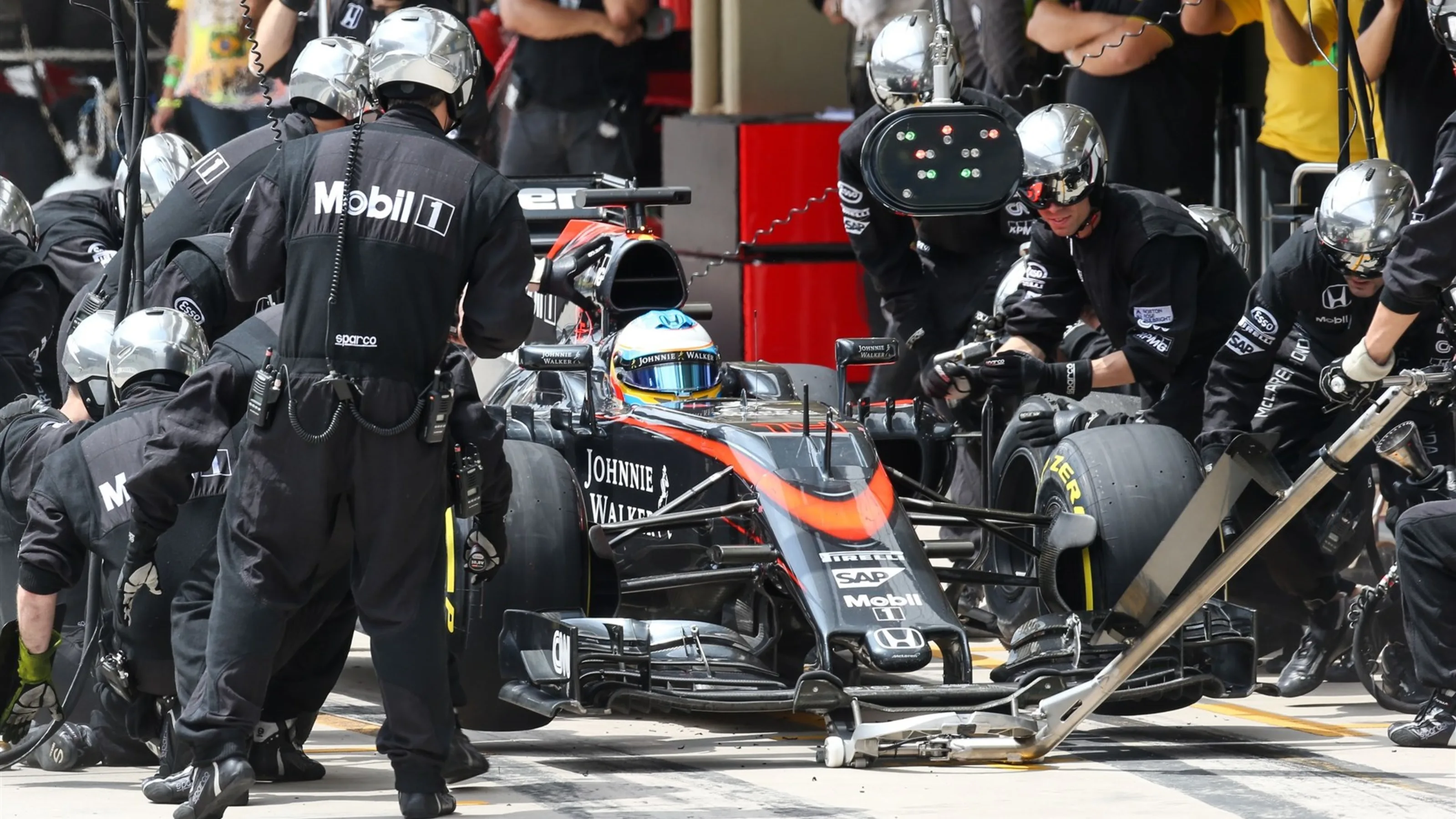 Fernando Alonso (ESP) McLaren MP4-30 pit stop at Formula One World Championship, Rd18, Brazilian