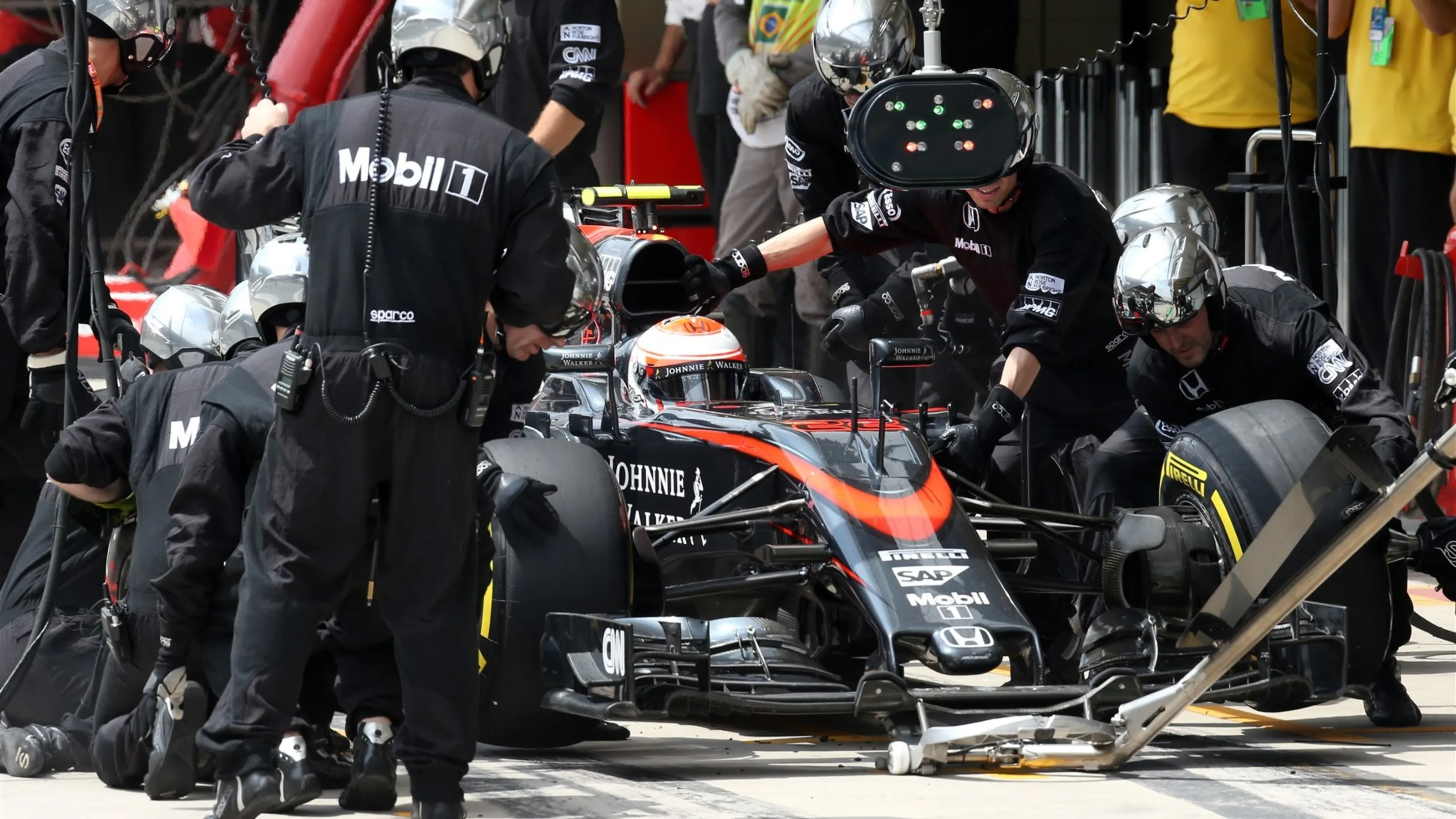 Jenson Button (GBR) McLaren MP4-30 pit stop at Formula One World Championship, Rd18, Brazilian