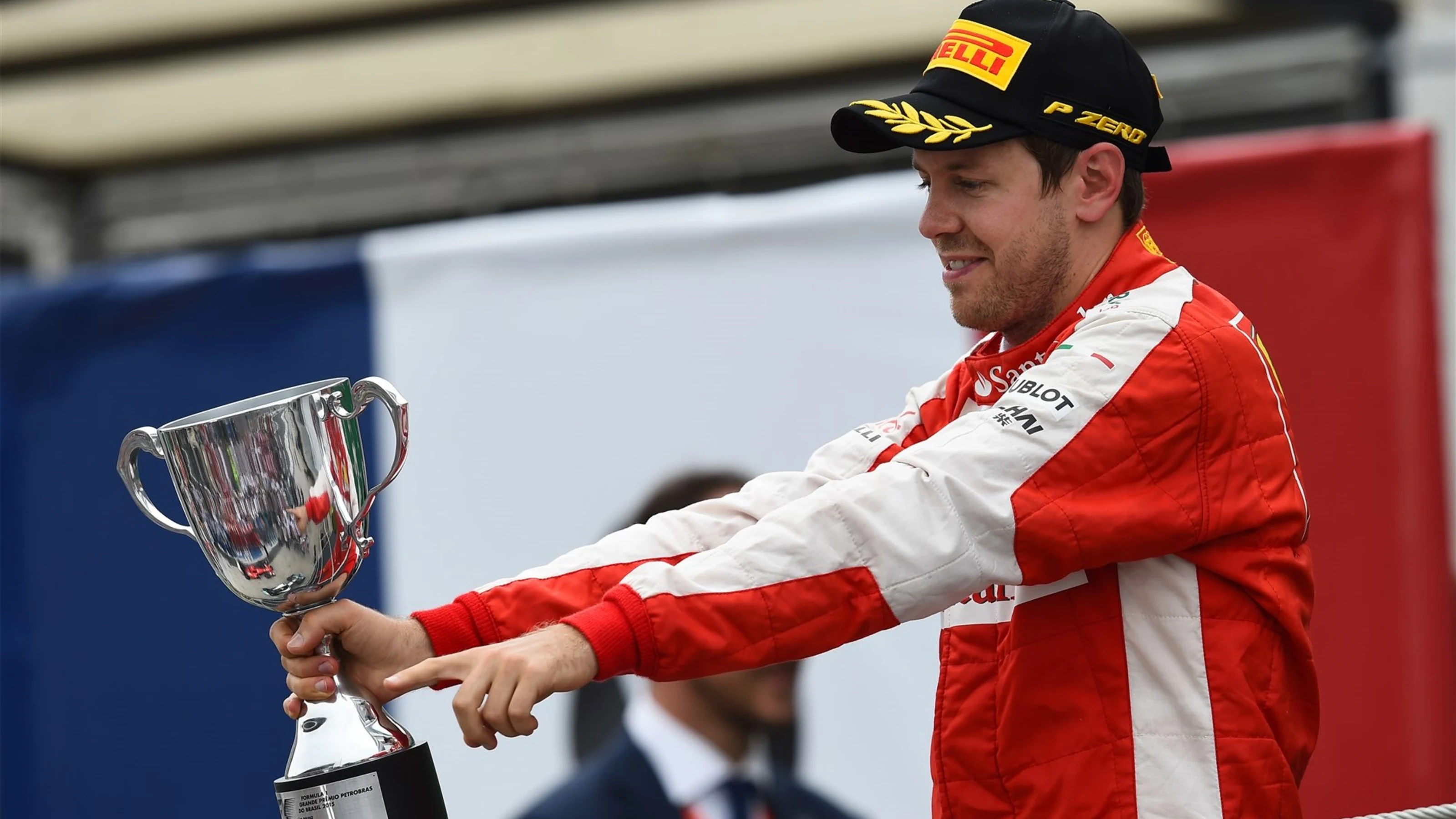 Sebastian Vettel (GER) Ferrari celebrates on the podium with the trophy at Formula One World