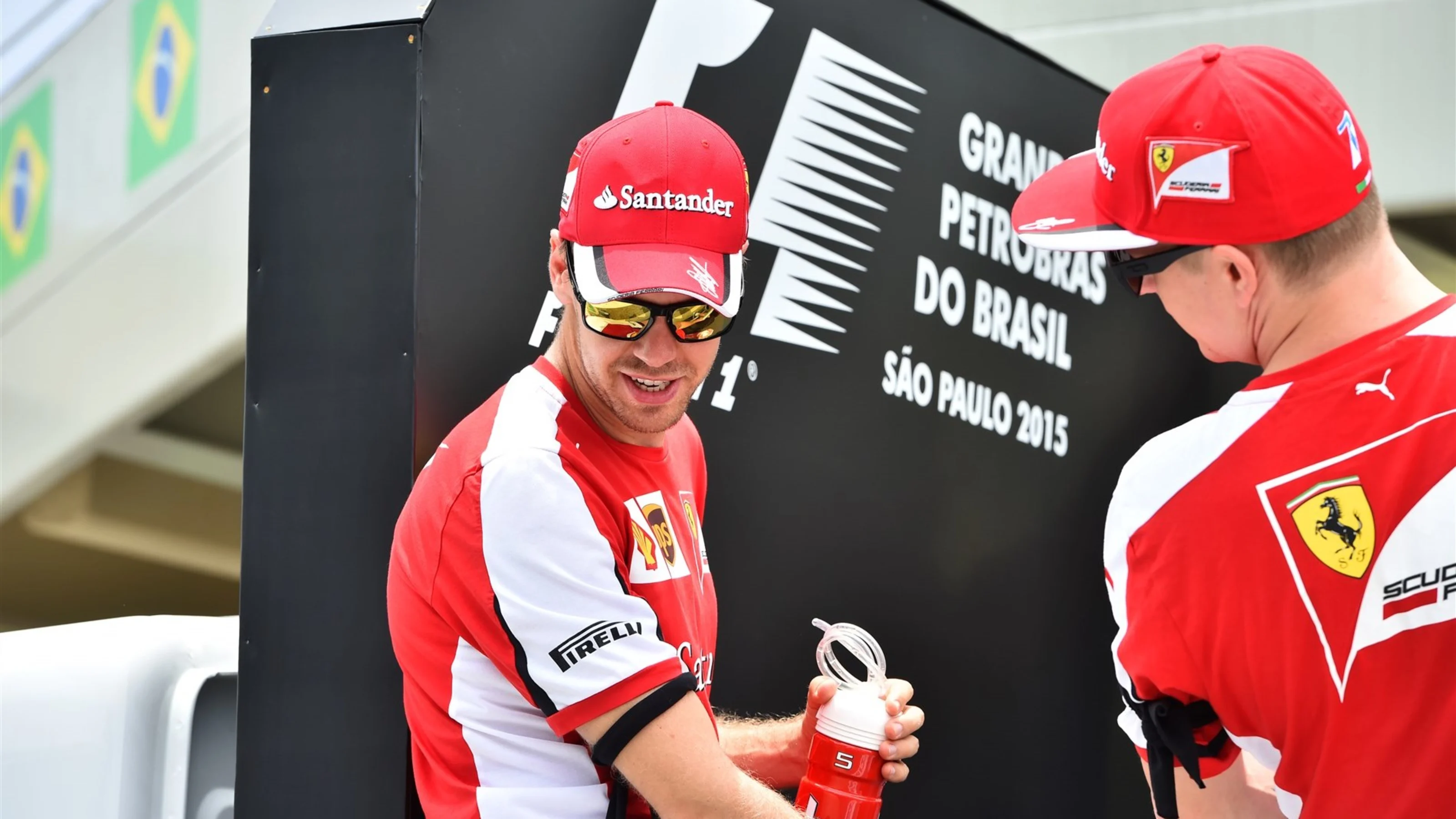 Sebastian Vettel (GER) Ferrari and Kimi Raikkonen (FIN) Ferrari on the drivers parade at Formula
