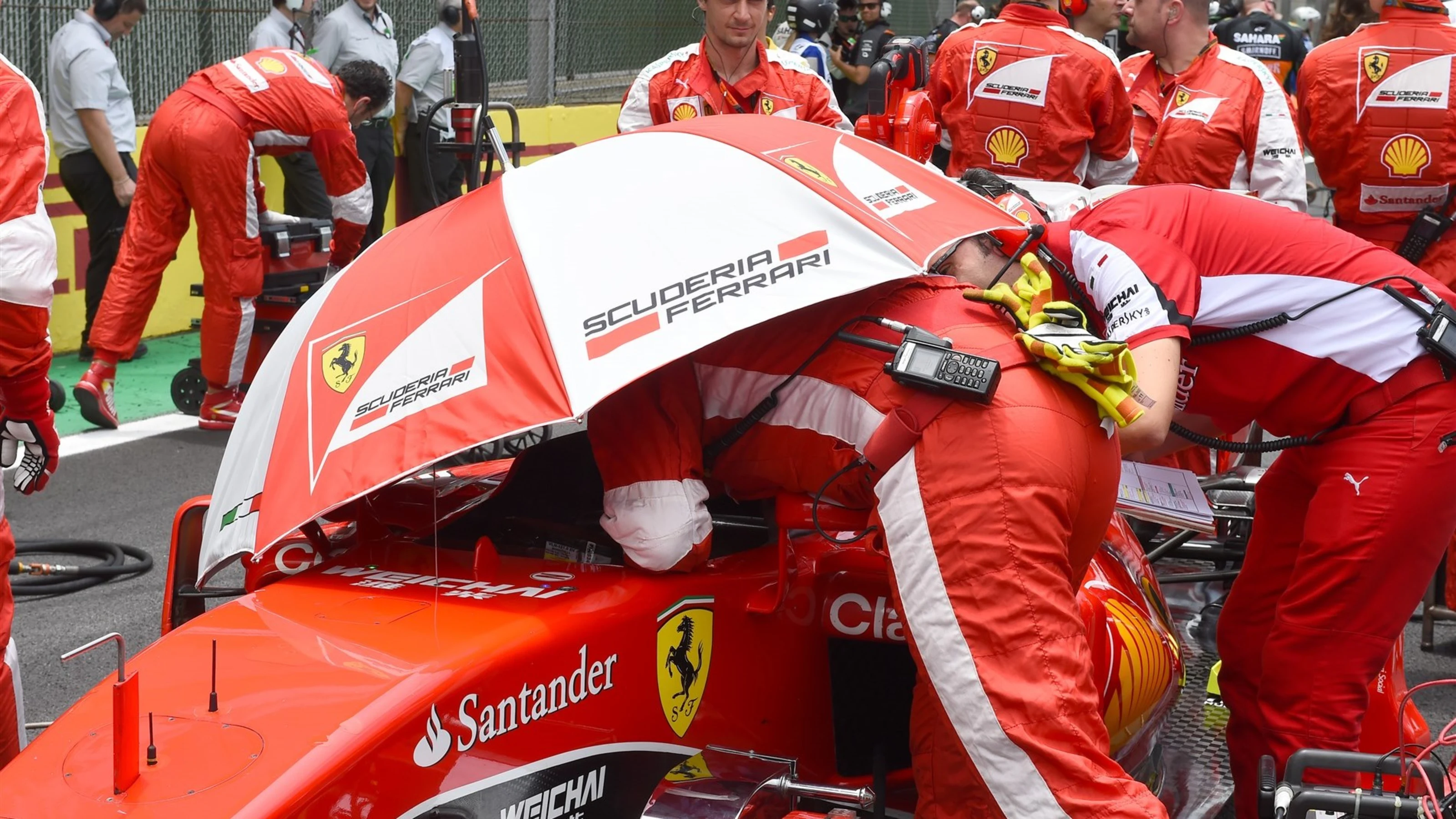 Sebastian Vettel (GER) Ferrari SF15-T on the grid at Formula One World Championship, Rd18,