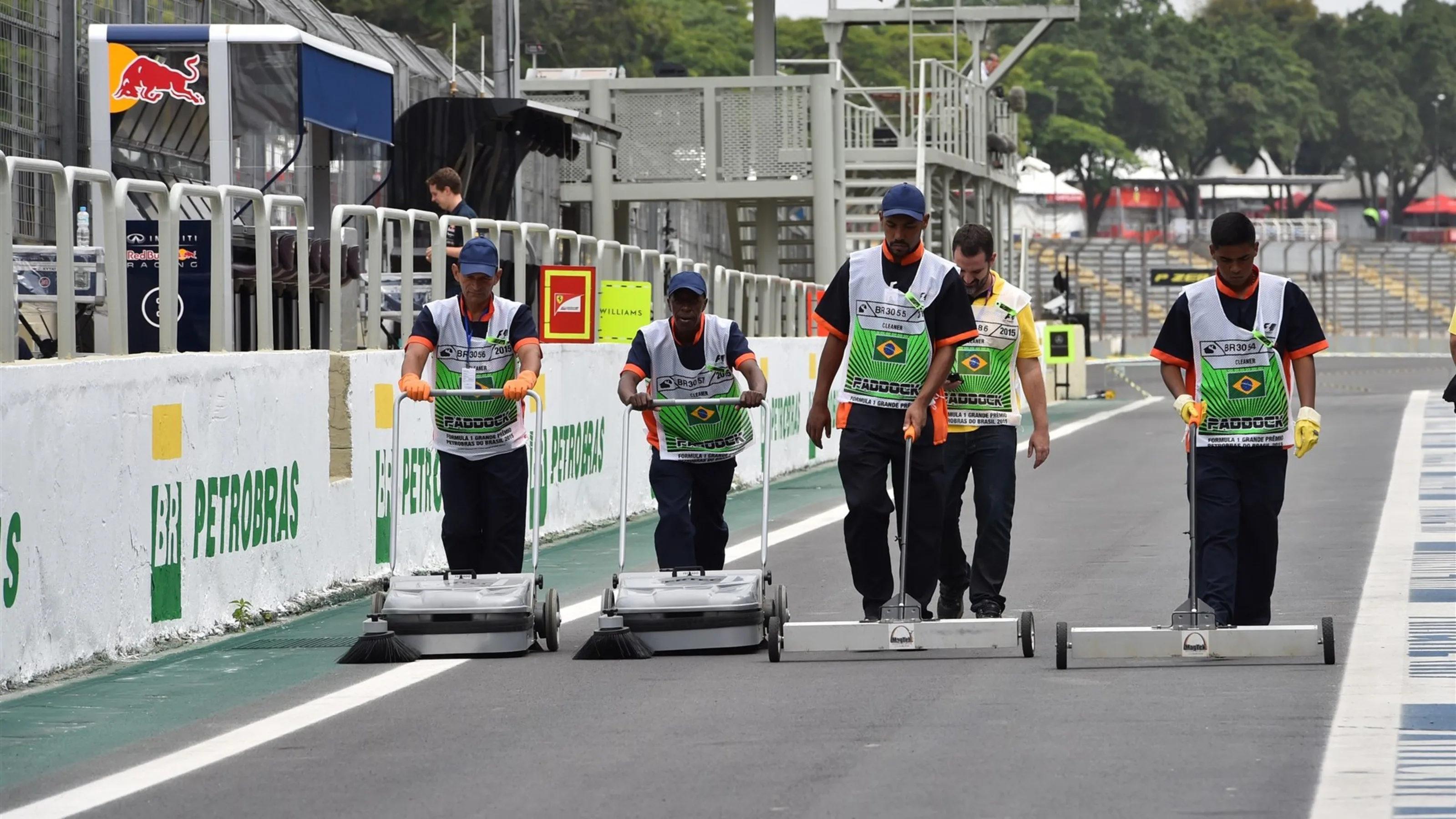 Workers clean the track at Formula One World Championship, Rd18, Brazilian Grand Prix,