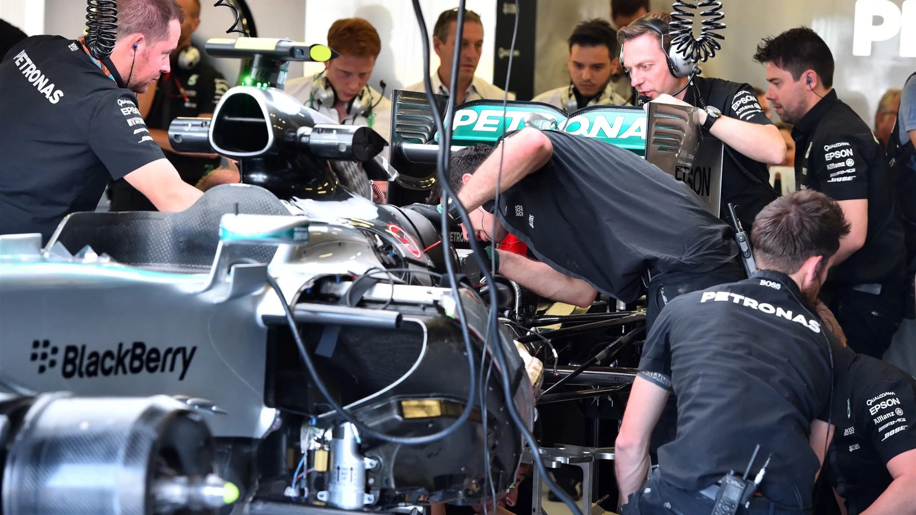 Mechanics work on the Mercedes AMG F1 W06 in the garage at Formula One World Championship, Rd9,