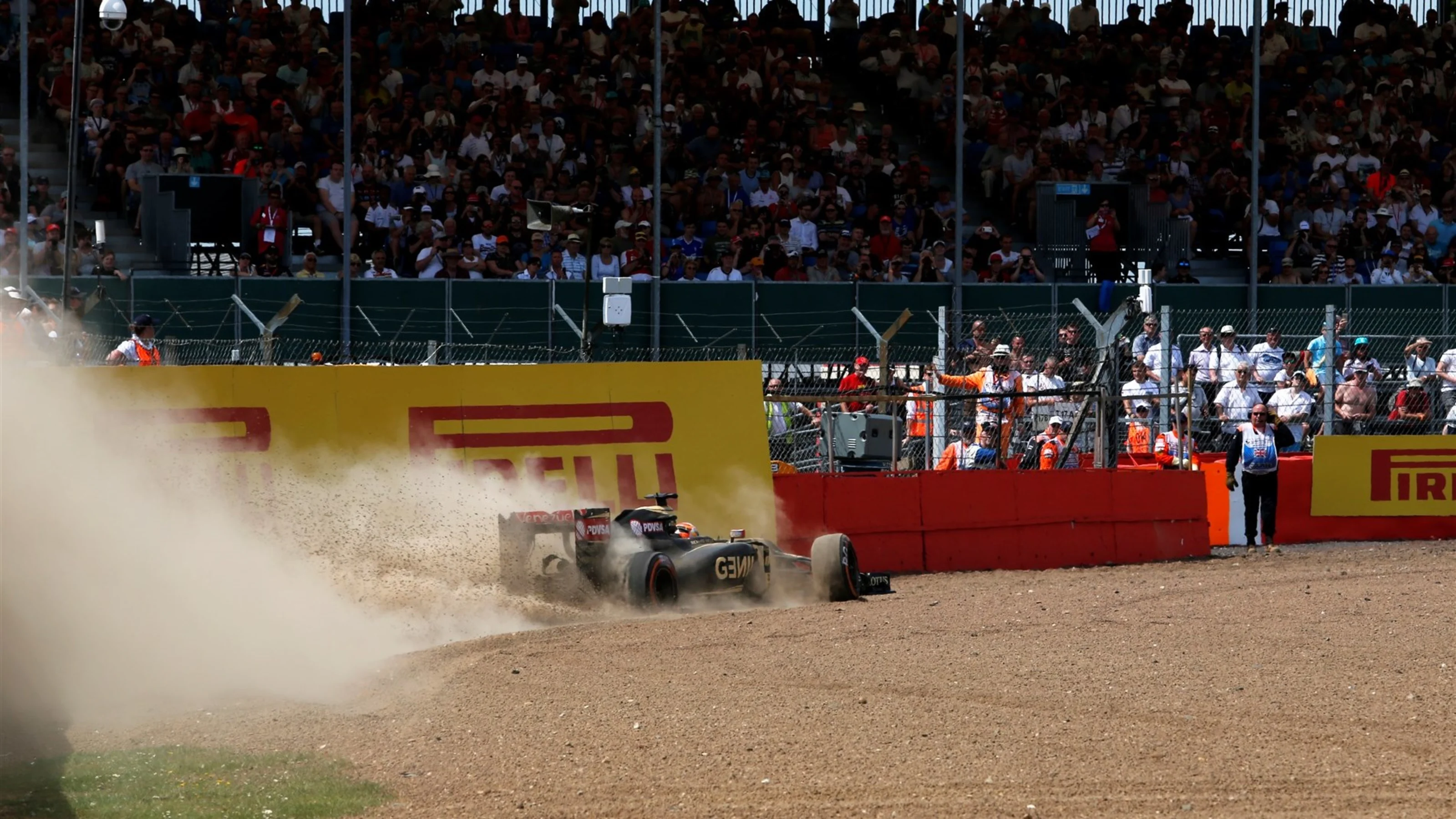 Romain Grosjean (FRA) Lotus E23 Hybrid spins into the gravel in FP2 at Formula One World