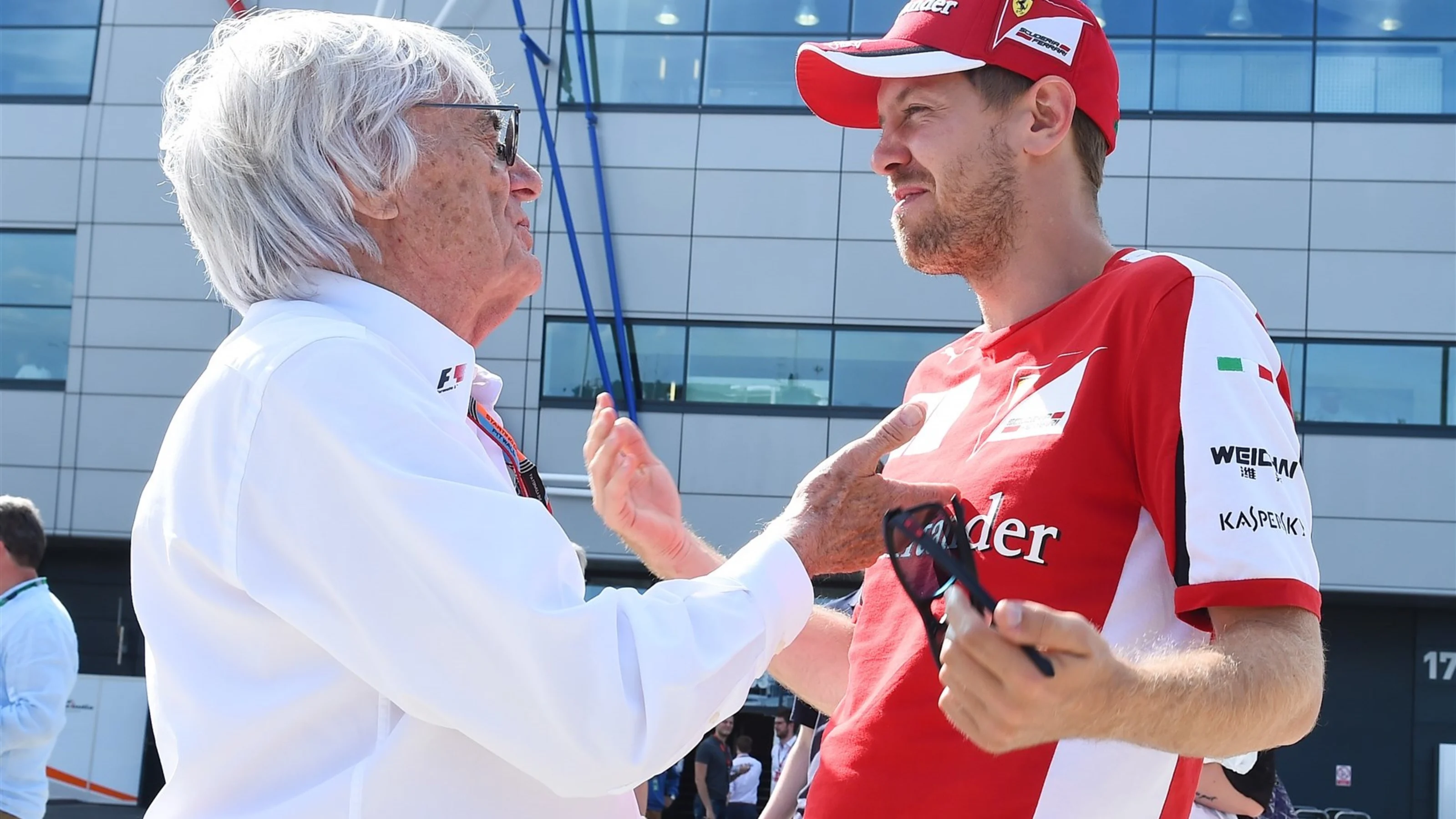 Bernie Ecclestone (GBR) CEO Formula One Group (FOM) talks with Sebastian Vettel (GER) Ferrari at