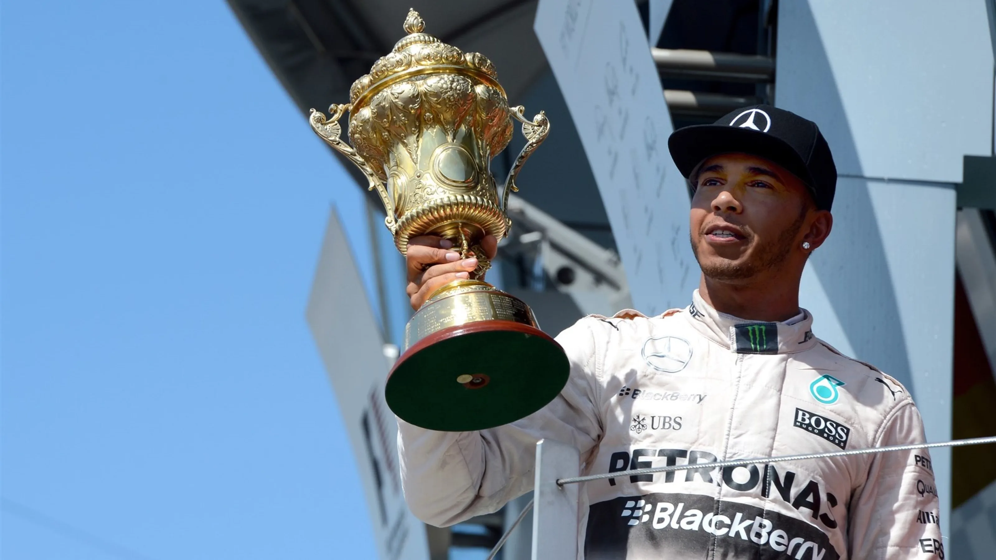 Race winner Lewis Hamilton (GBR) Mercedes AMG F1 celebrates in with the trophy on the podium at