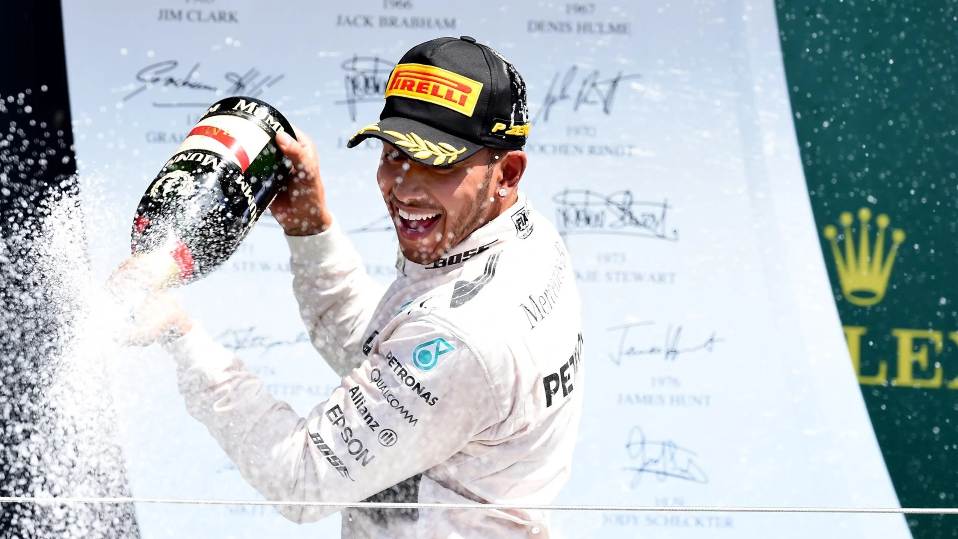 Race winner Lewis Hamilton (GBR) Mercedes AMG F1 celebrates on the podium with champagne at Formula