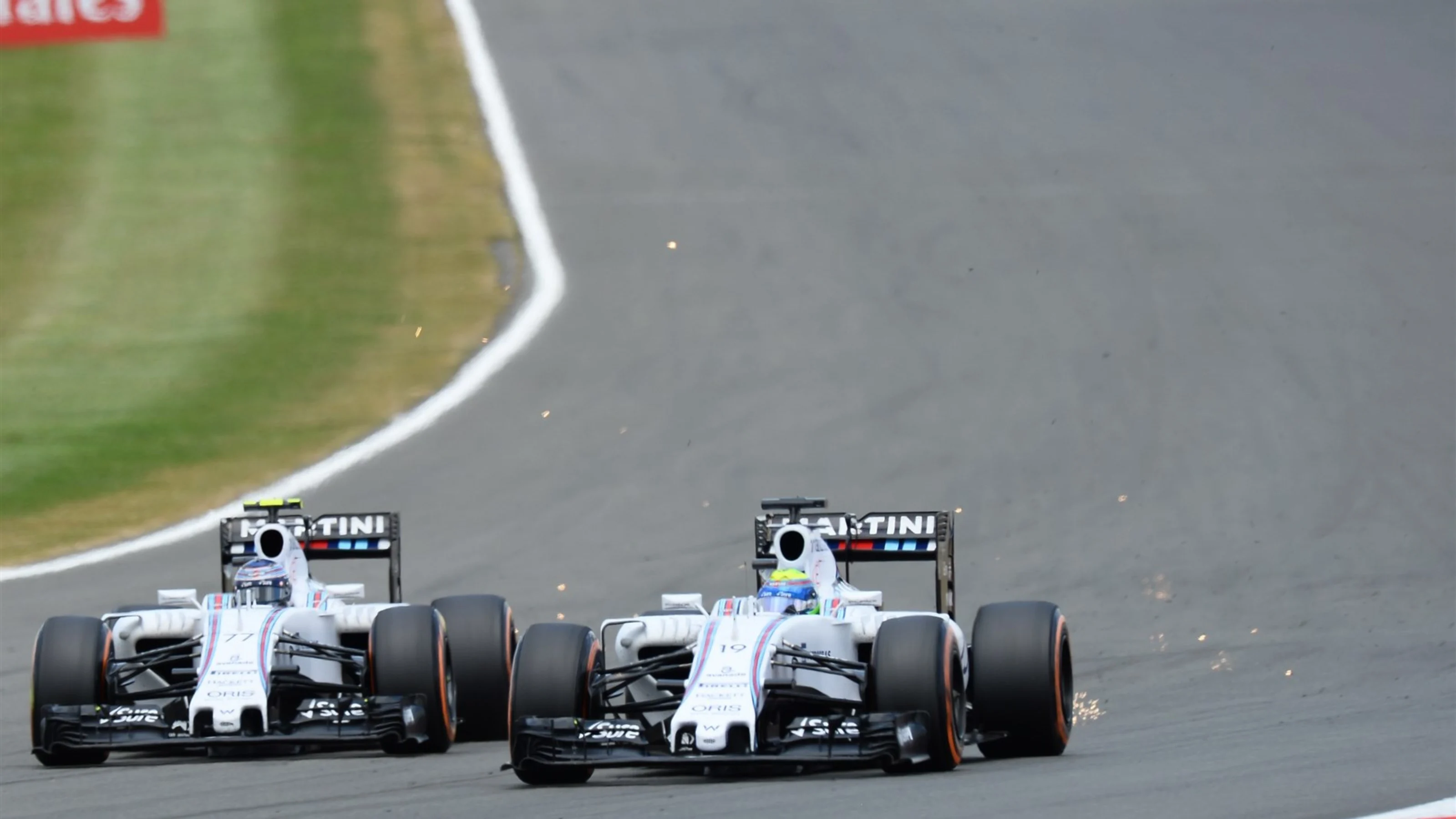 Valtteri Bottas (FIN) Williams FW37 battles with Felipe Massa (BRA) Williams FW37 at Formula One