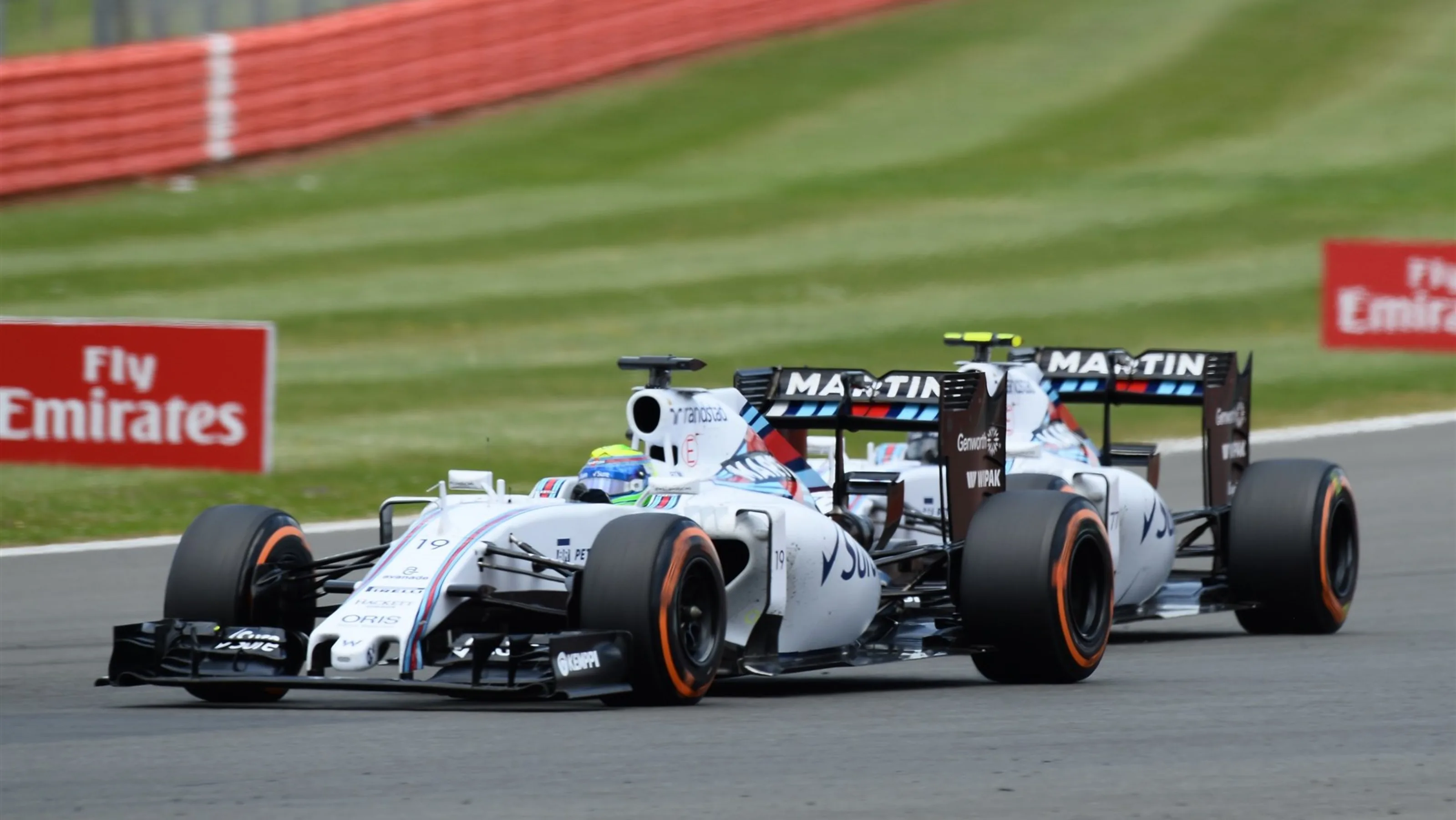 Felipe Massa (BRA) Williams FW37 battles with Valtteri Bottas (FIN) Williams FW37 at Formula One