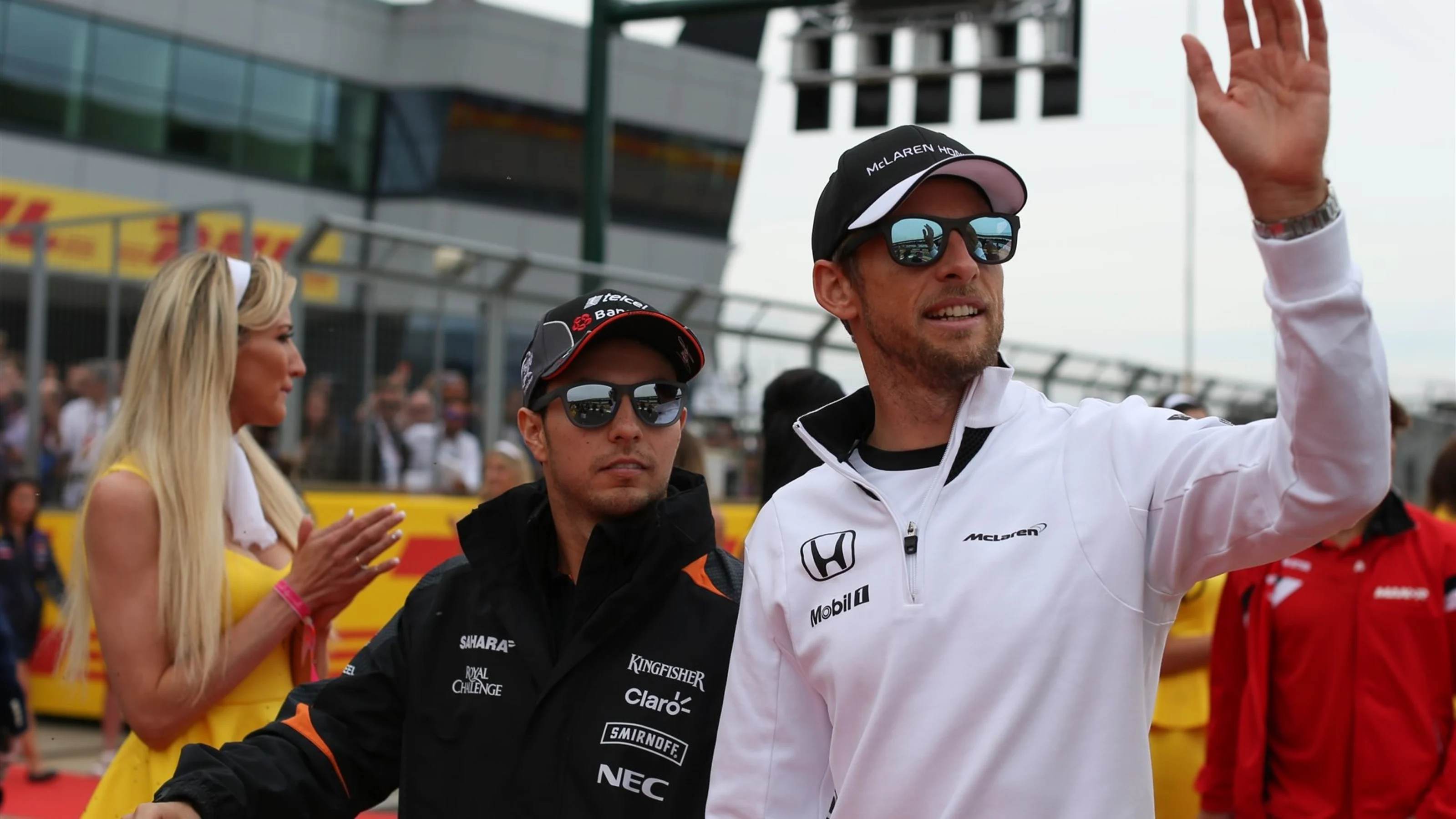 Sergio Perez (MEX) Force India and Jenson Button (GBR) McLaren at the drivers parade at Formula One