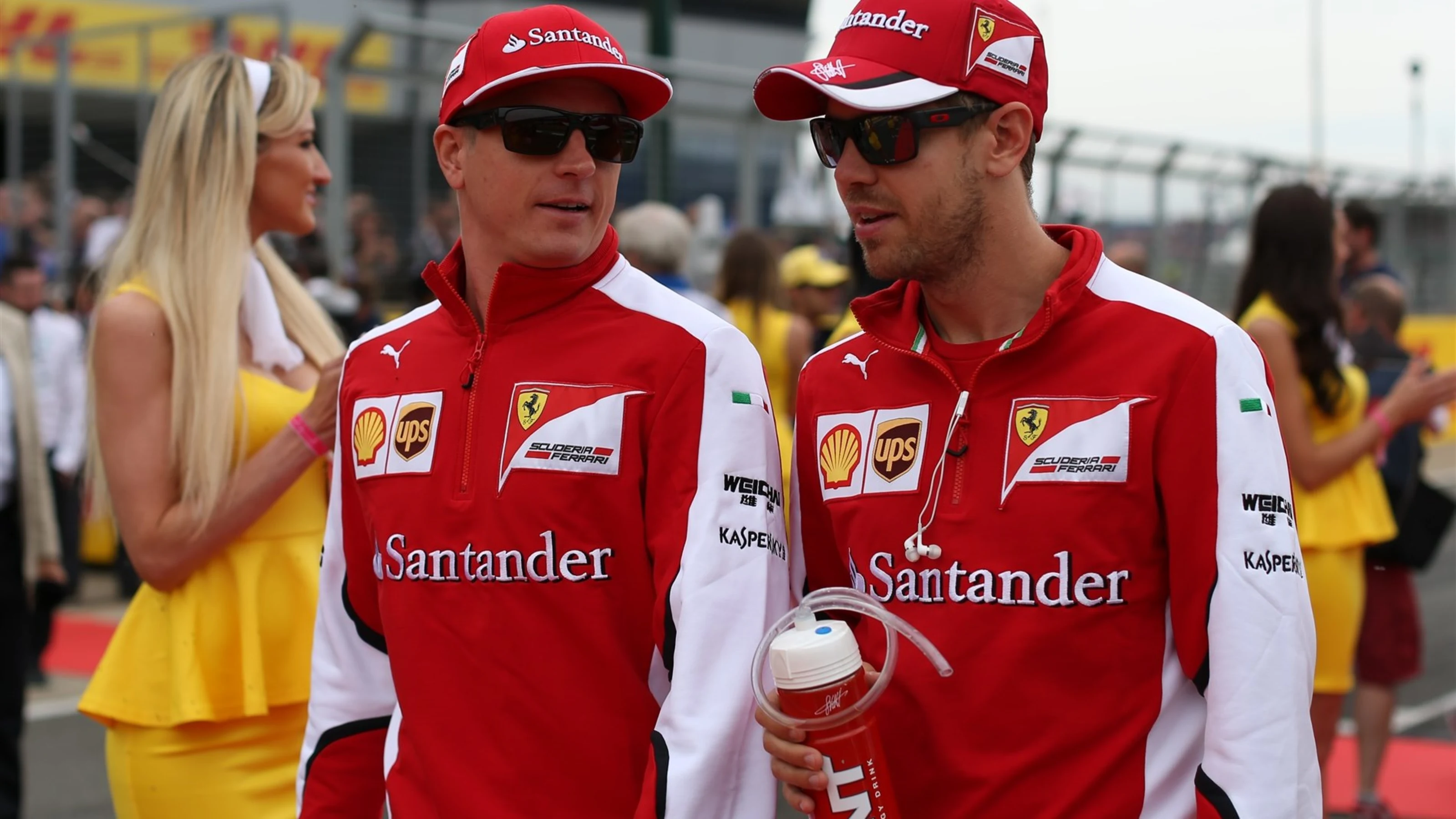 Kimi Raikkonen (FIN) Ferrari and Sebastian Vettel (GER) Ferrari at the drivers parade at Formula