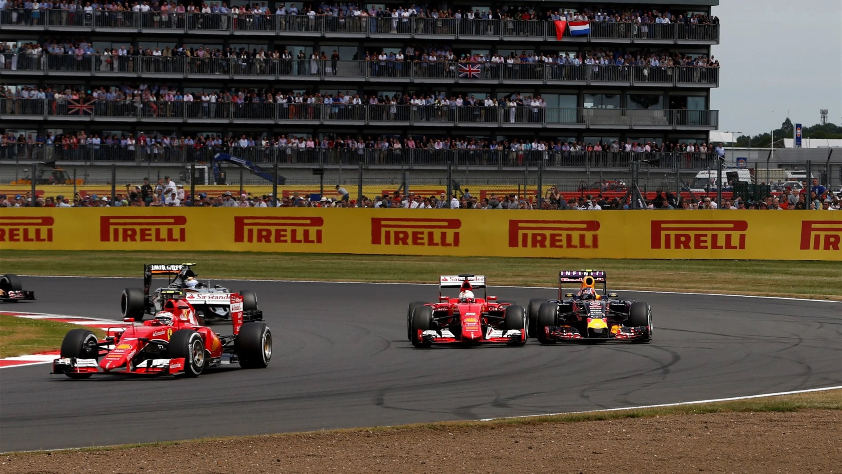 Sebastian Vettel (GER) Ferrari SF15-T and Daniil Kvyat (RUS) Red Bull Racing RB11 battle at Formula