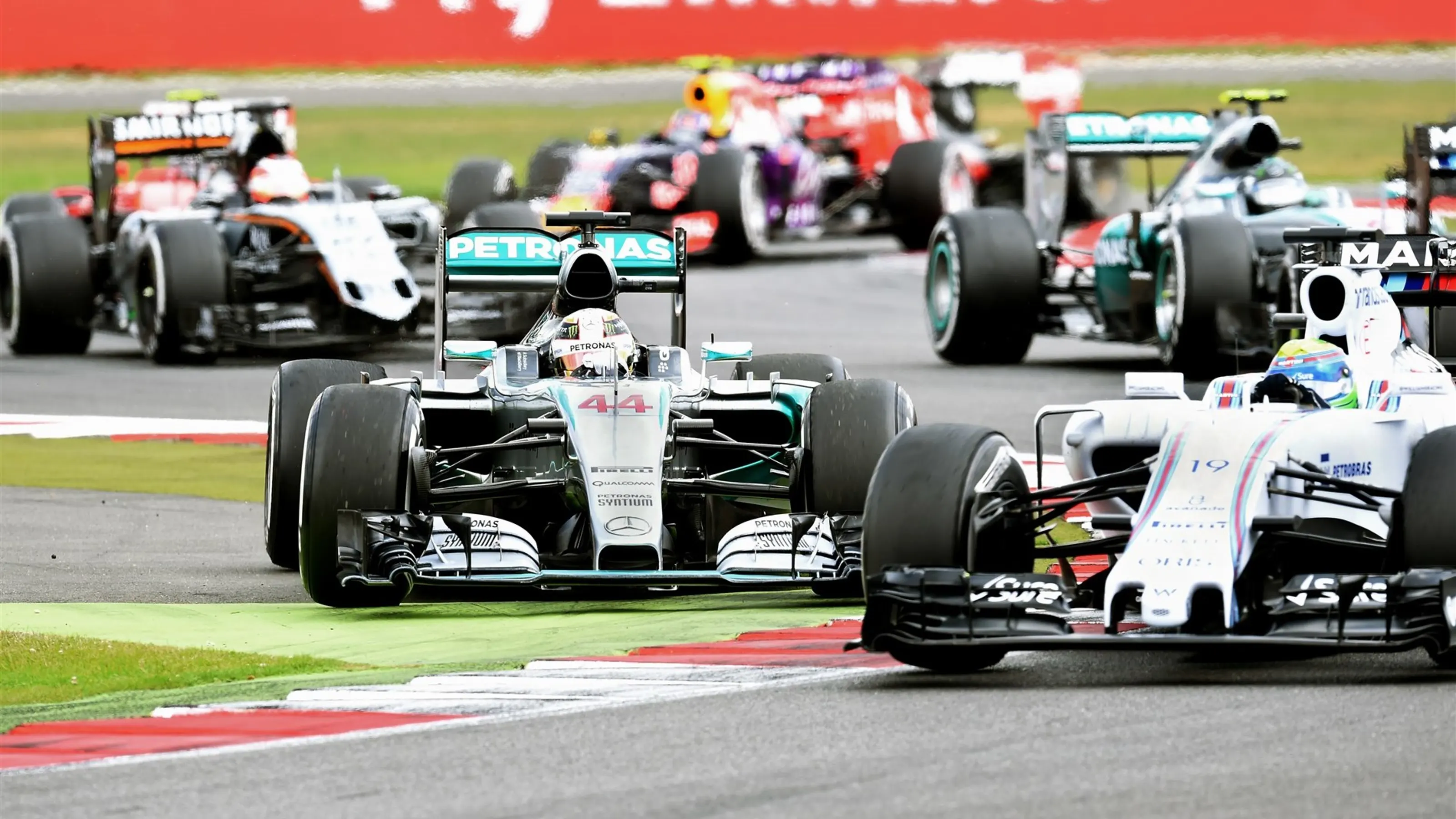 Lewis Hamilton (GBR) Mercedes AMG F1 W06 and Felipe Massa (BRA) Williams FW37 battle at Formula One