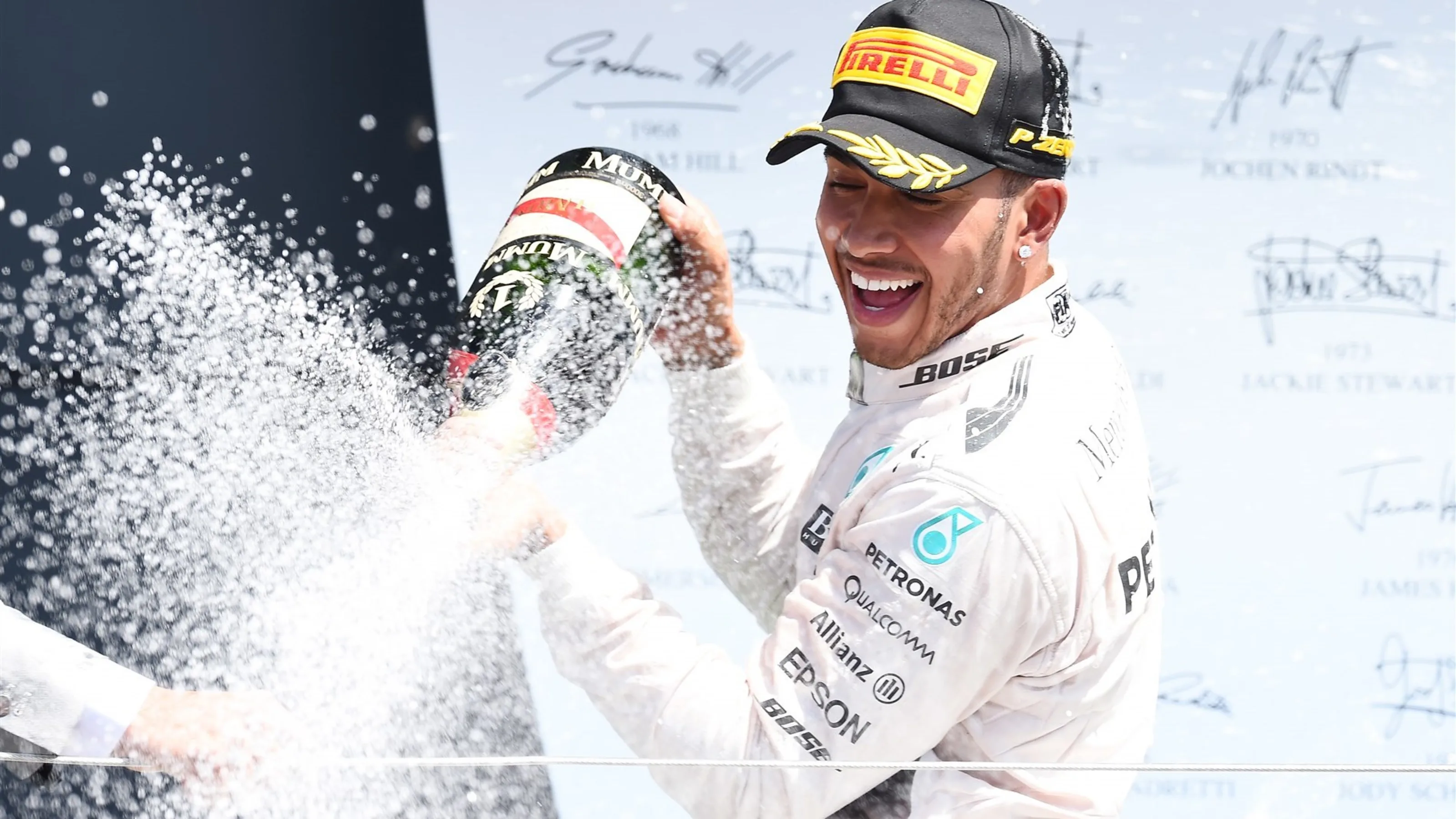 Race winner Lewis Hamilton (GBR) Mercedes AMG F1 celebrates on the podium with the champagne at
