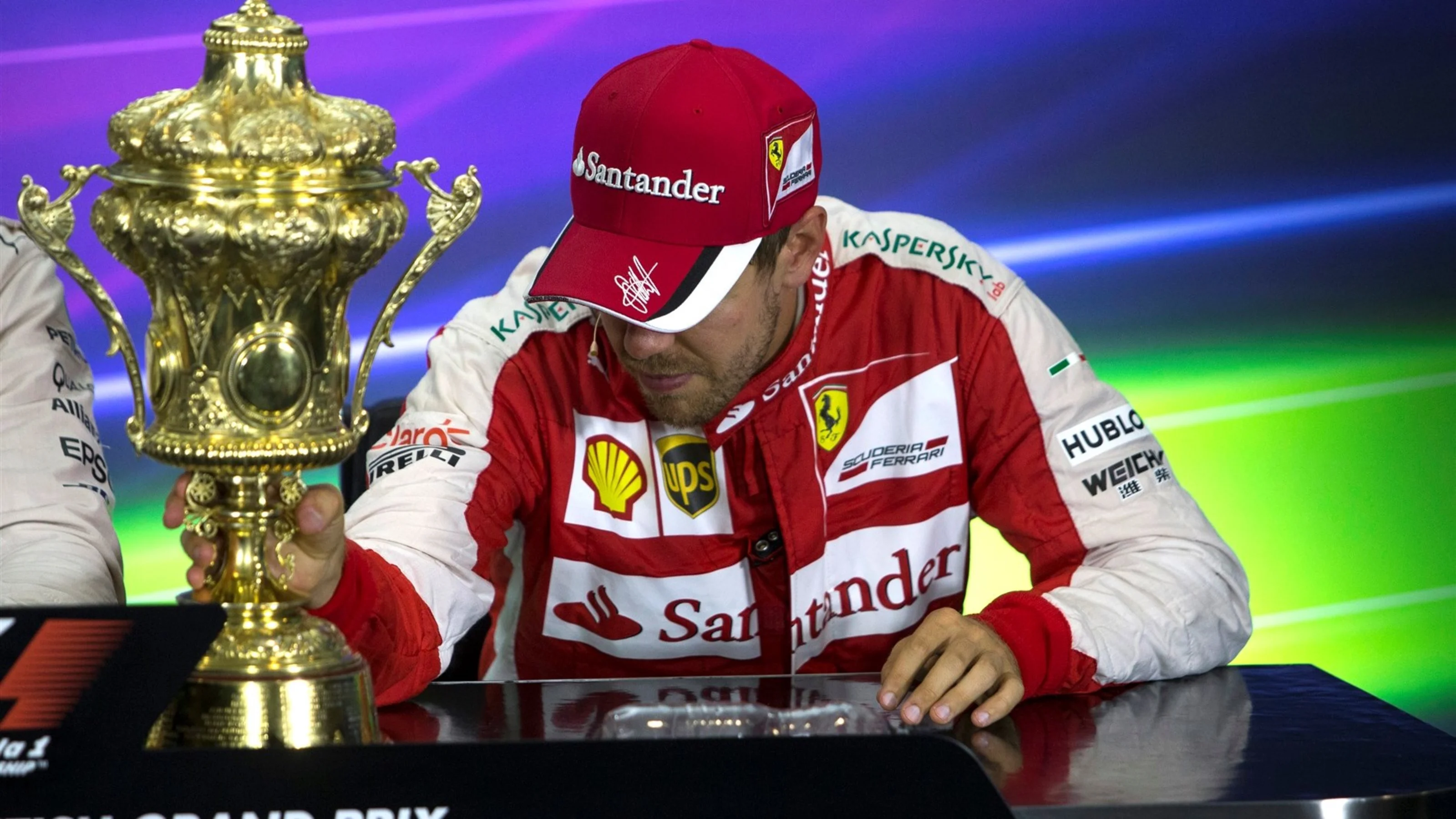 Sebastian Vettel (GER) Ferrari SF15-T in the press conference with the trophy at Formula One World