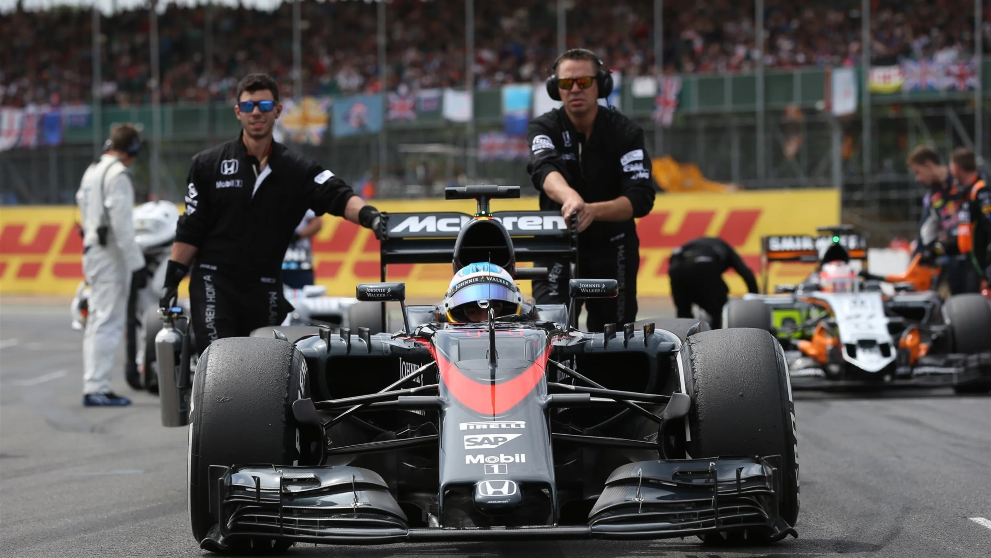 Fernando Alonso (ESP) McLaren MP4-30 on the grid at Formula One World Championship, Rd9, British