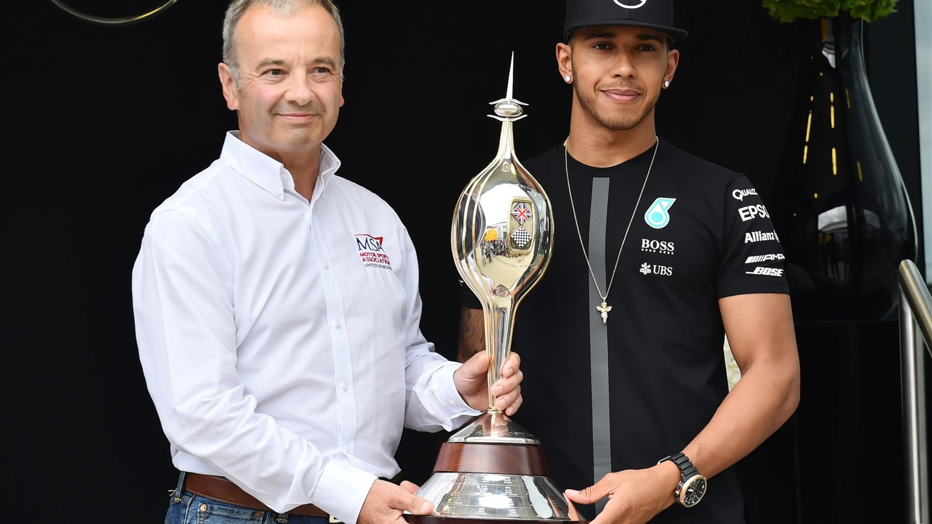 Lewis Hamilton (GBR) Mercedes AMG F1 receives the Hawthorn Memorial Trophy from Rob Jones (GBR)
