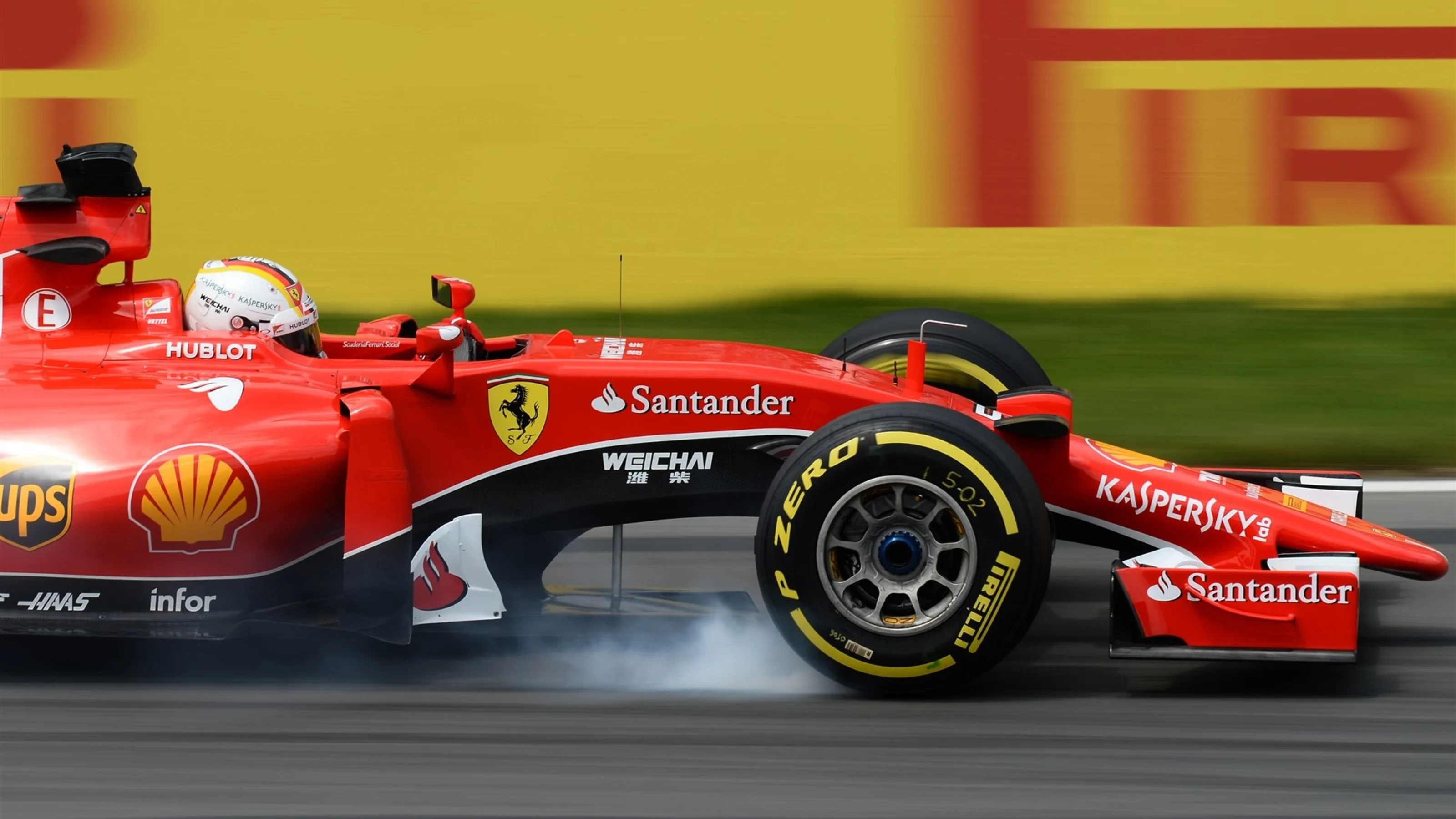 Sebastian Vettel (GER) Ferrari SF15-T locks up at Formula One World Championship, Rd7, Canadian