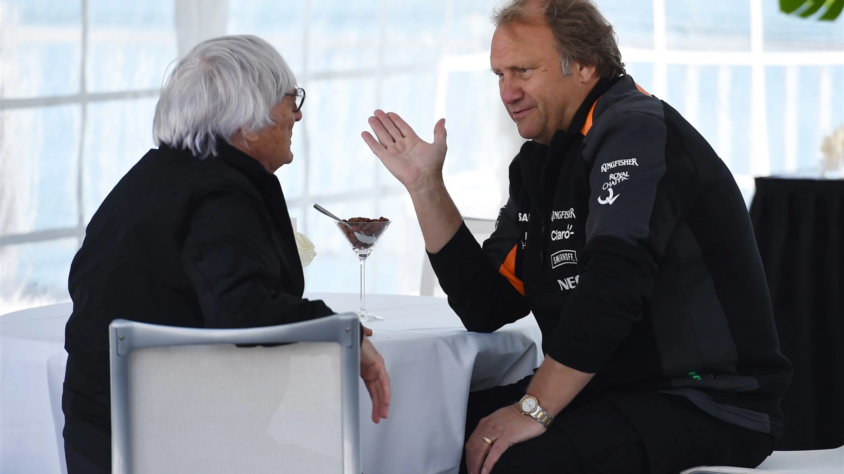 Robert Fearnley (GBR) Force India F1 Team Deputy Team Principal talks with Bernie Ecclestone (GBR)
