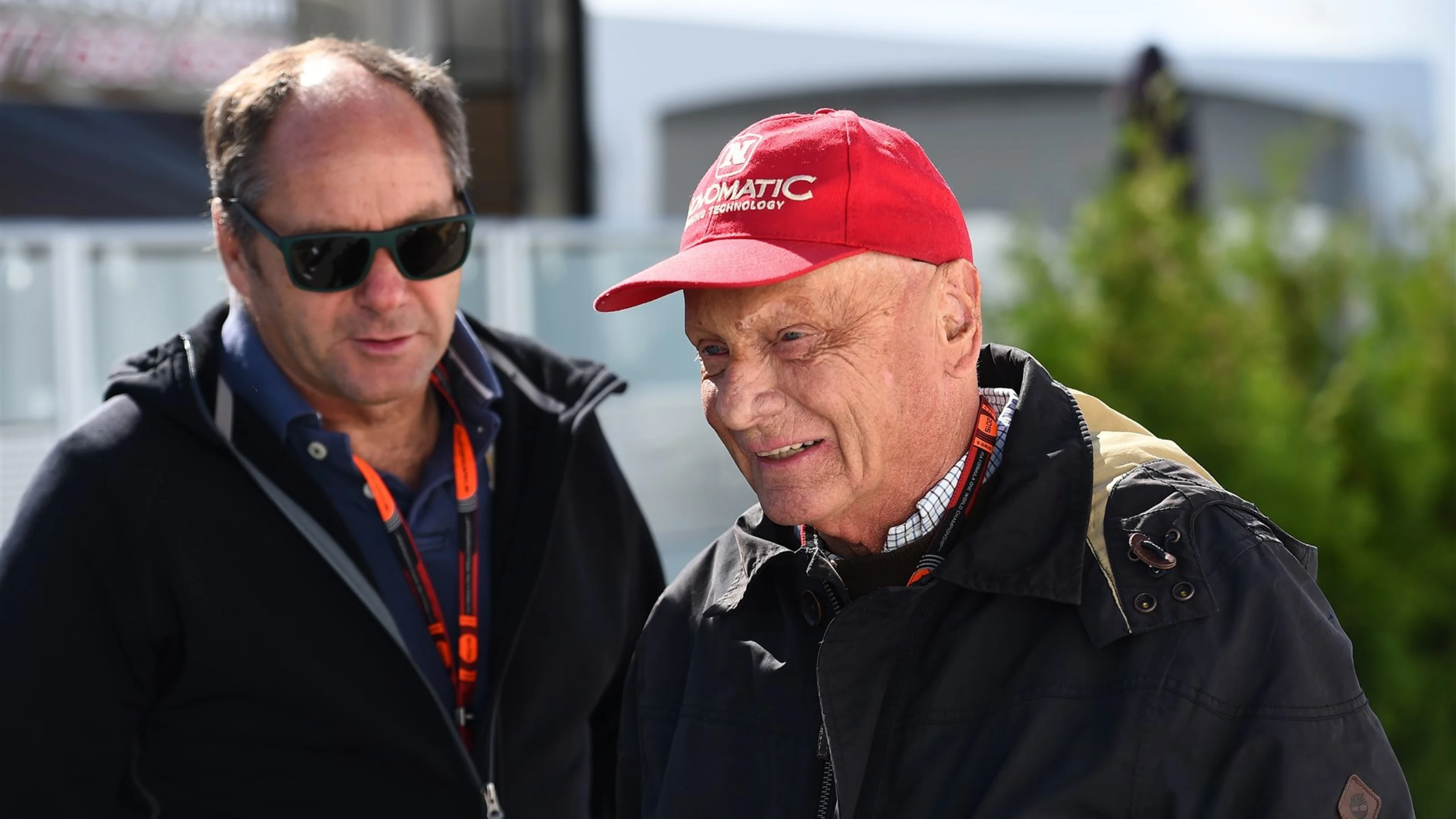 Niki Lauda (AUT) Mercedes AMG F1 Non-Executive Chairman talks with Gerhard Berger (AUT) Former F1