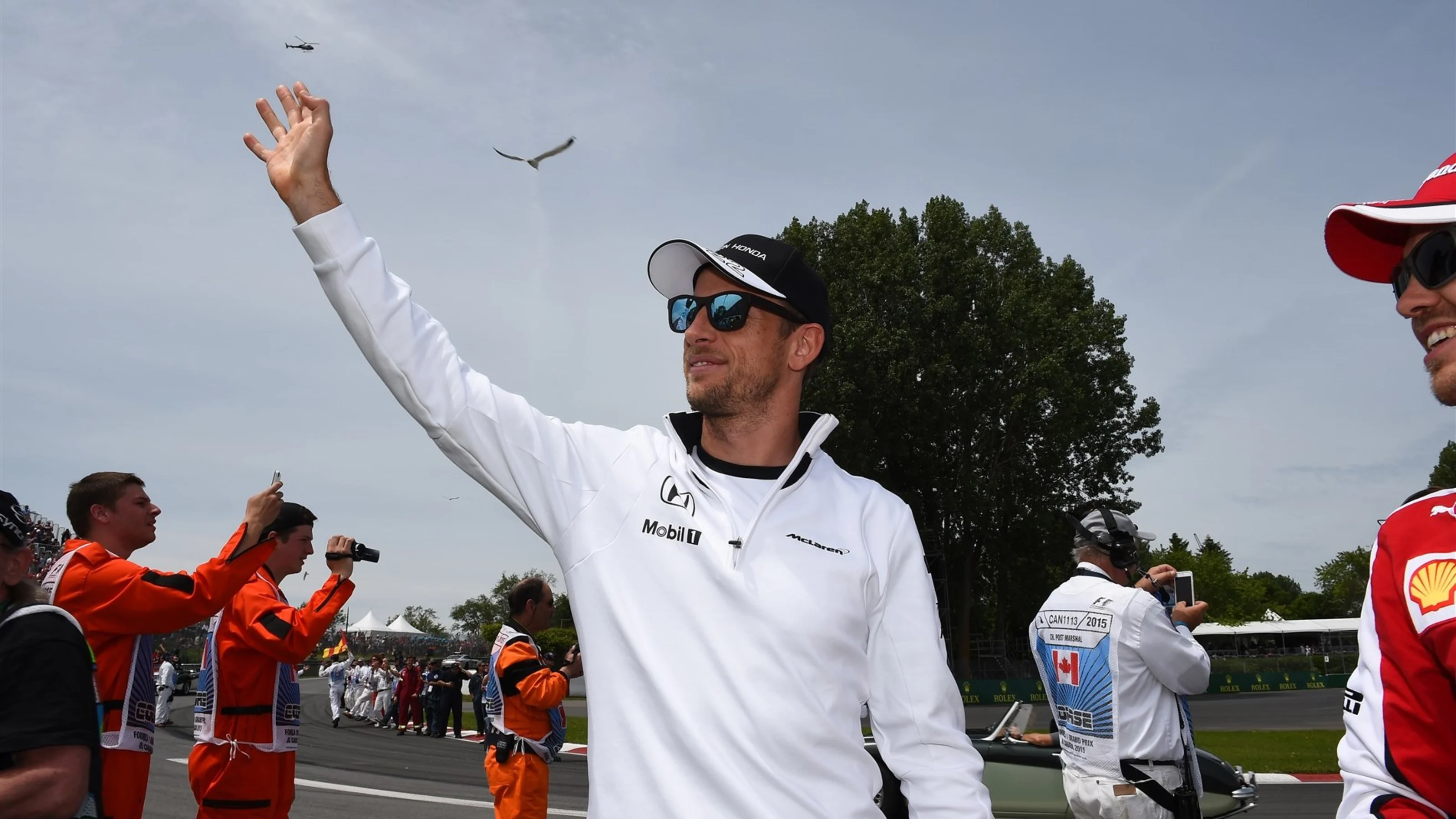 Jenson Button (GBR) McLaren and Sebastian Vettel (GER) Ferrari on the drivers parade at Formula One