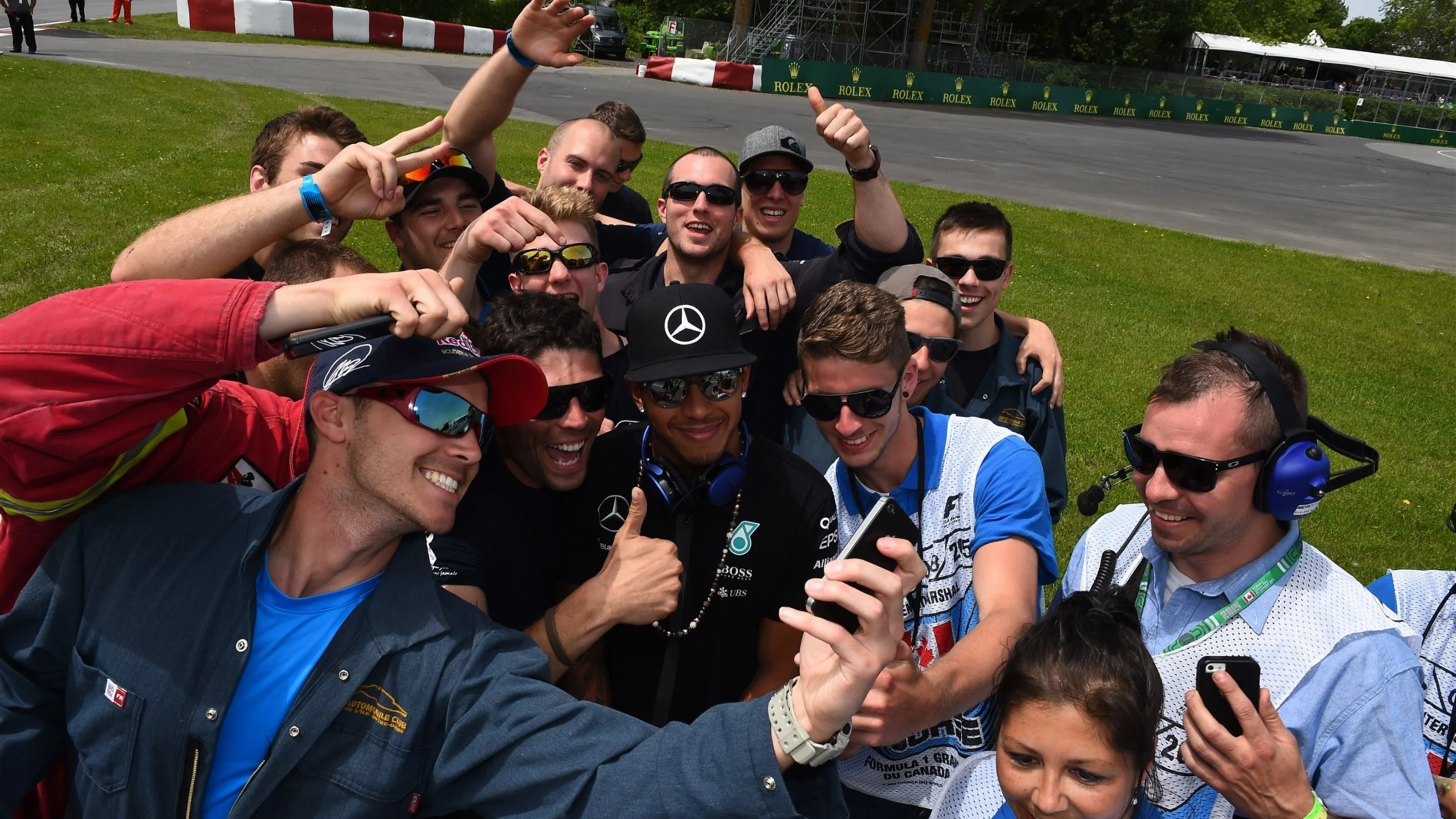 Lewis Hamilton (GBR) Mercedes AMG F1 with marshals on the drivers parade at Formula One World