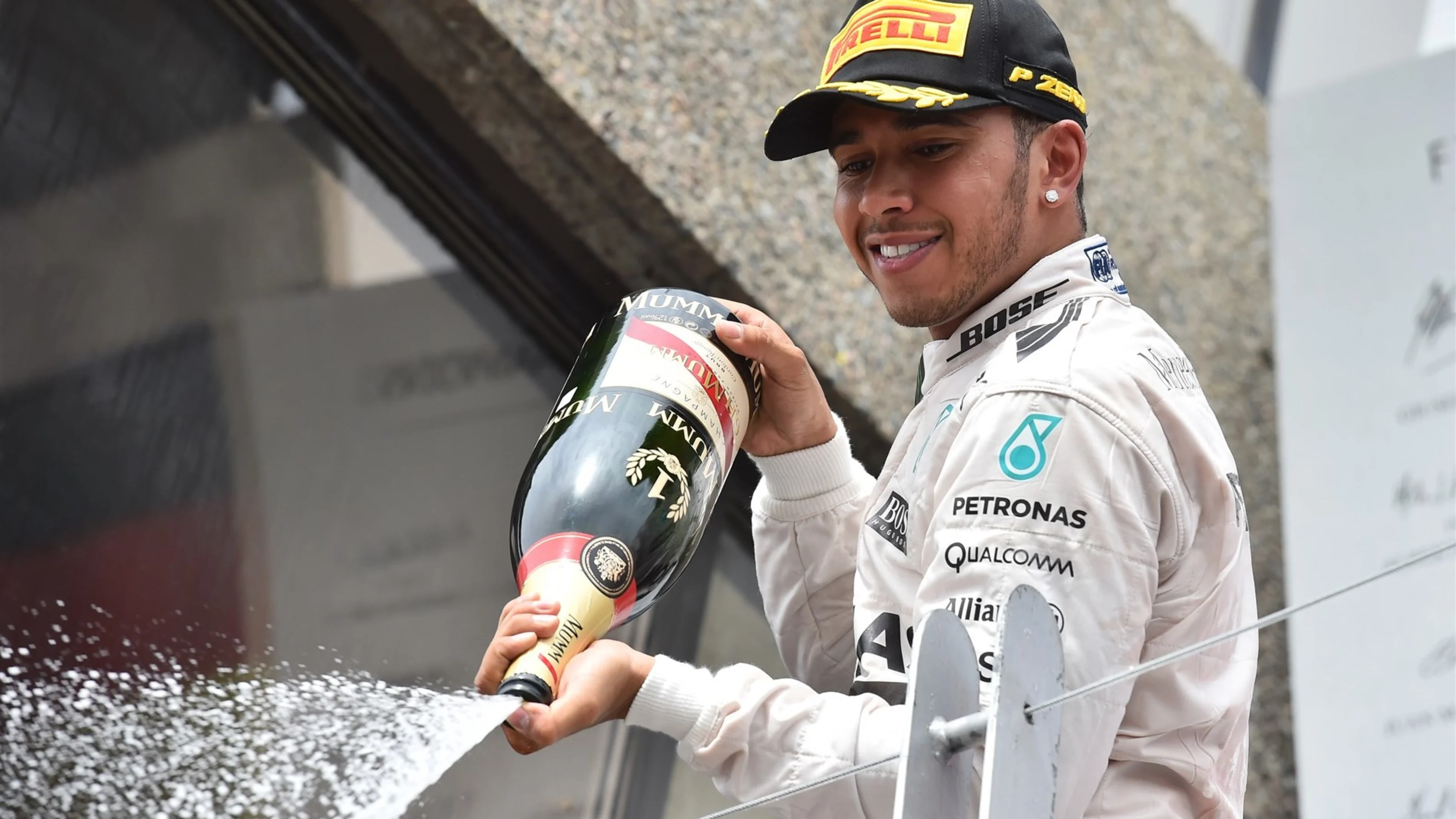 Race winner Lewis Hamilton (GBR) Mercedes AMG F1 celebrates on the Podium with the champagne at