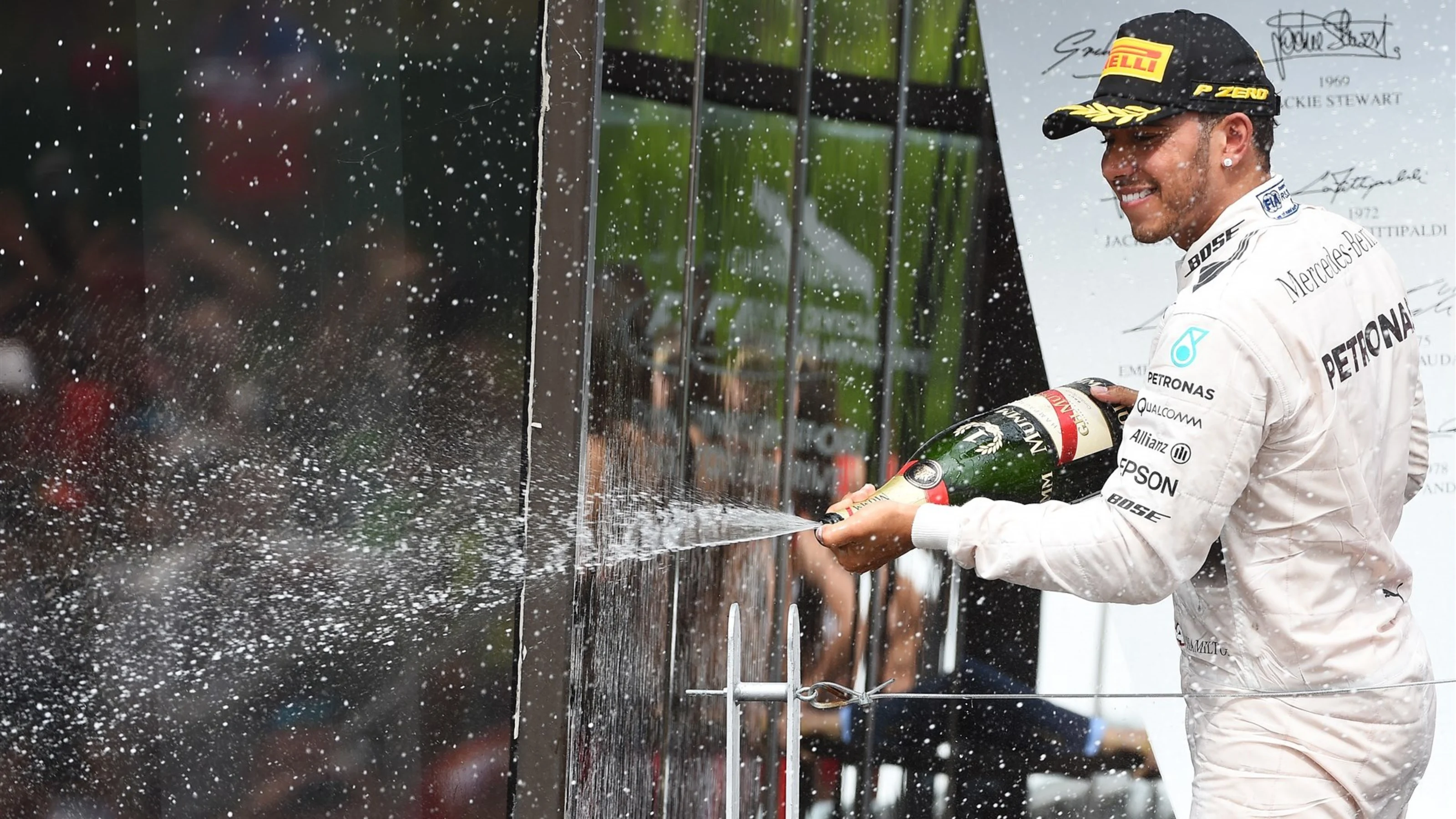 Race winner Lewis Hamilton (GBR) Mercedes AMG F1 celebrates on the podium with the champagne at