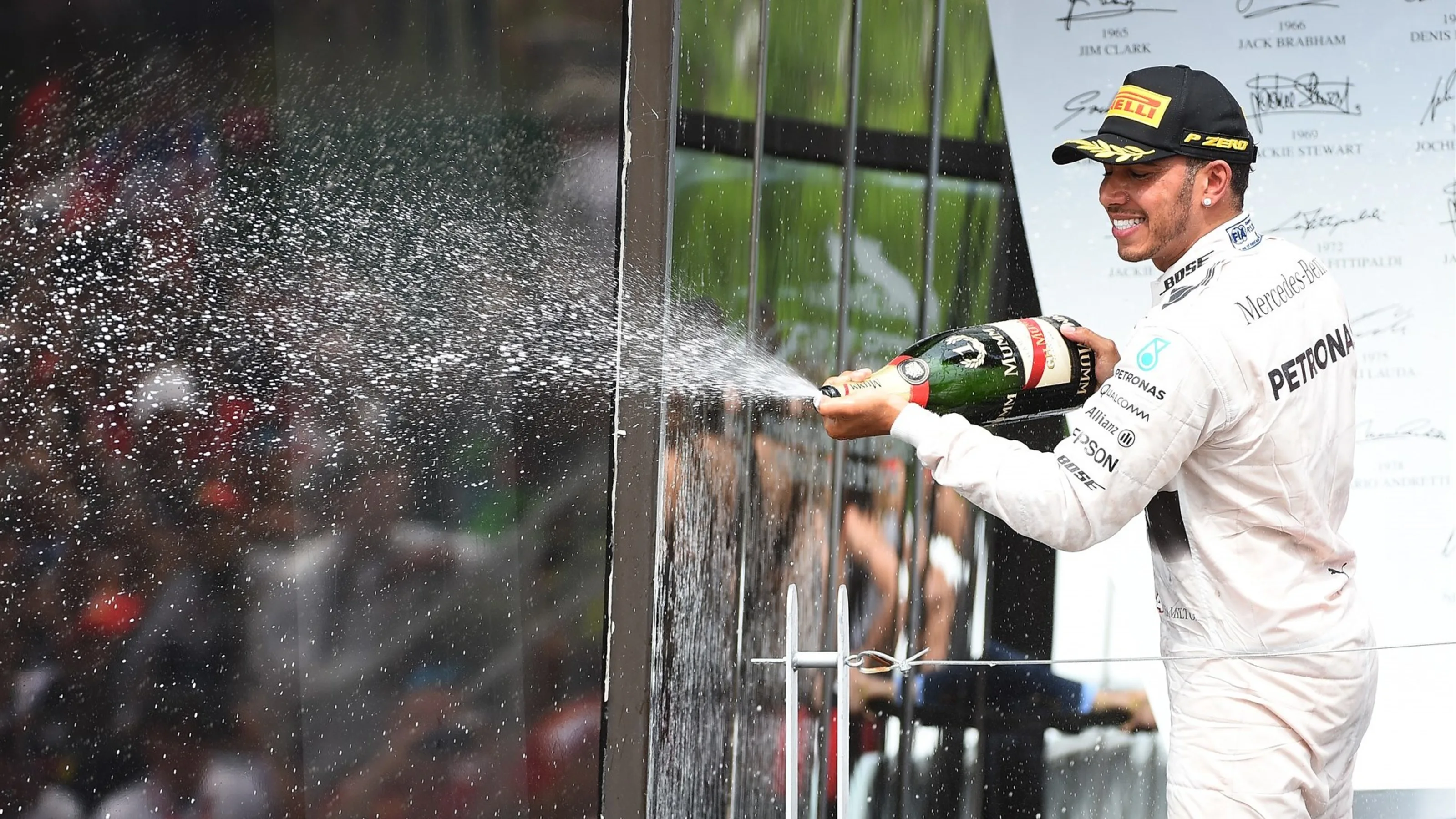 Race winner Lewis Hamilton (GBR) Mercedes AMG F1 celebrates on the podium with the champagne at