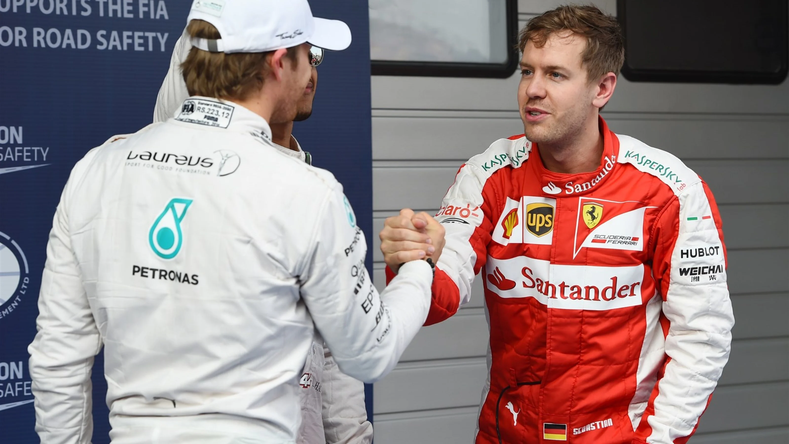 Nico Rosberg (GER) Mercedes AMG F1 shakes hands with Sebastian Vettel (GER) Ferrari in Parc Ferme