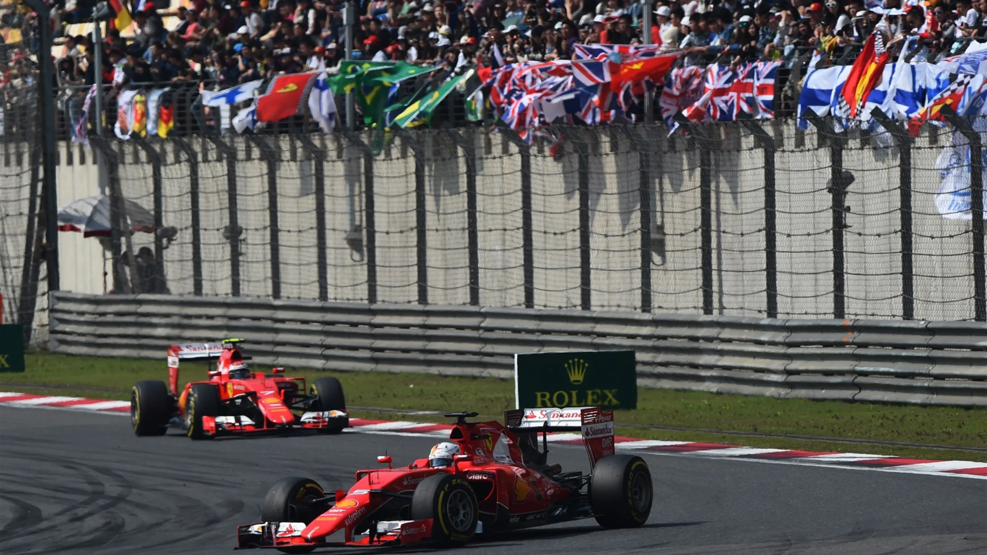 Sebastian Vettel (GER) Ferrari SF15-T leads Kimi Raikkonen (FIN) Ferrari SF15-T at Formula One