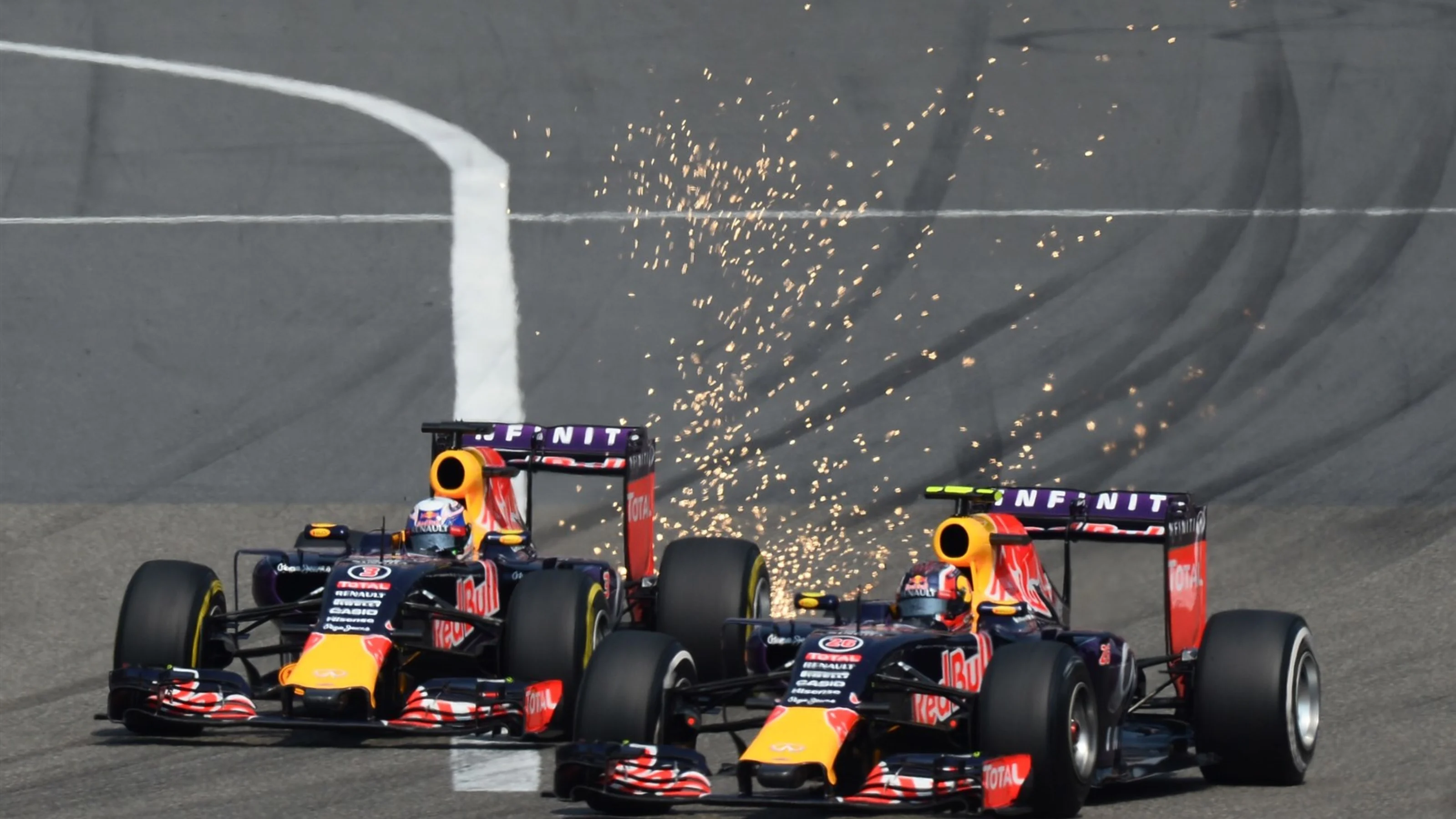 Daniel Ricciardo (AUS) Red Bull Racing RB11 AND Daniil Kvyat (RUS) Red Bull Racing RB11 BATTLE at