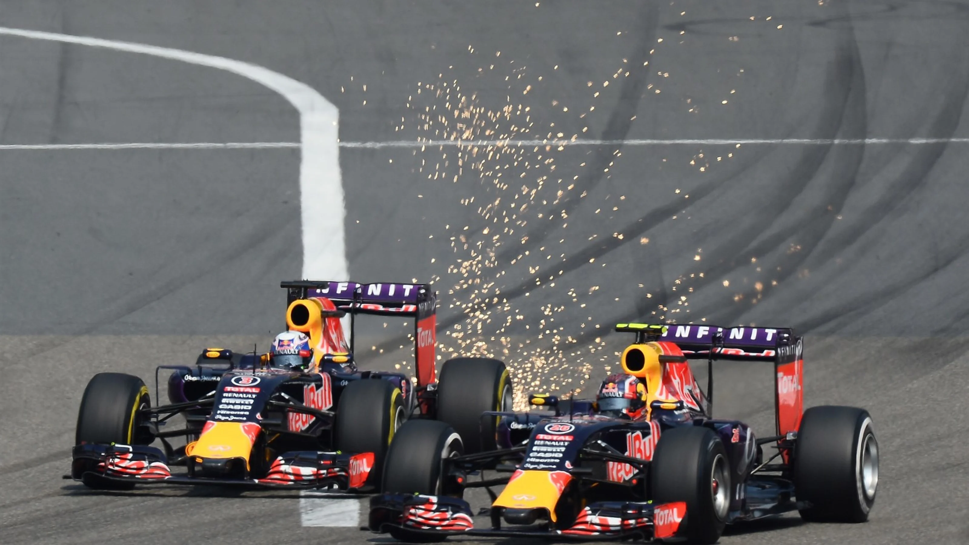 Daniel Ricciardo (AUS) Red Bull Racing RB11 and Daniil Kvyat (RUS) Red Bull Racing RB11 battle at