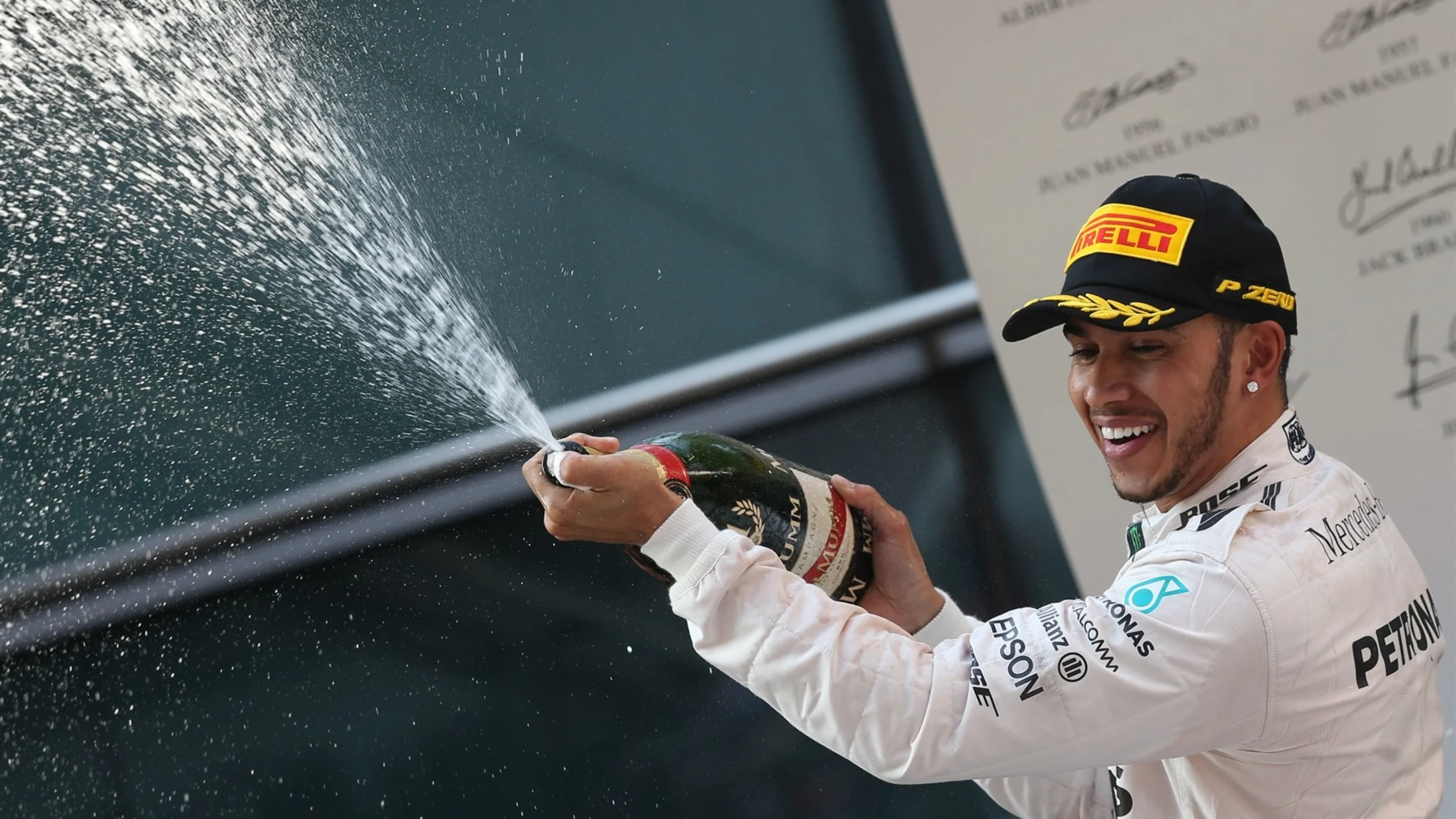 Race winner Lewis Hamilton (GBR) Mercedes AMG F1 celebrates with champagne on the podium at Formula