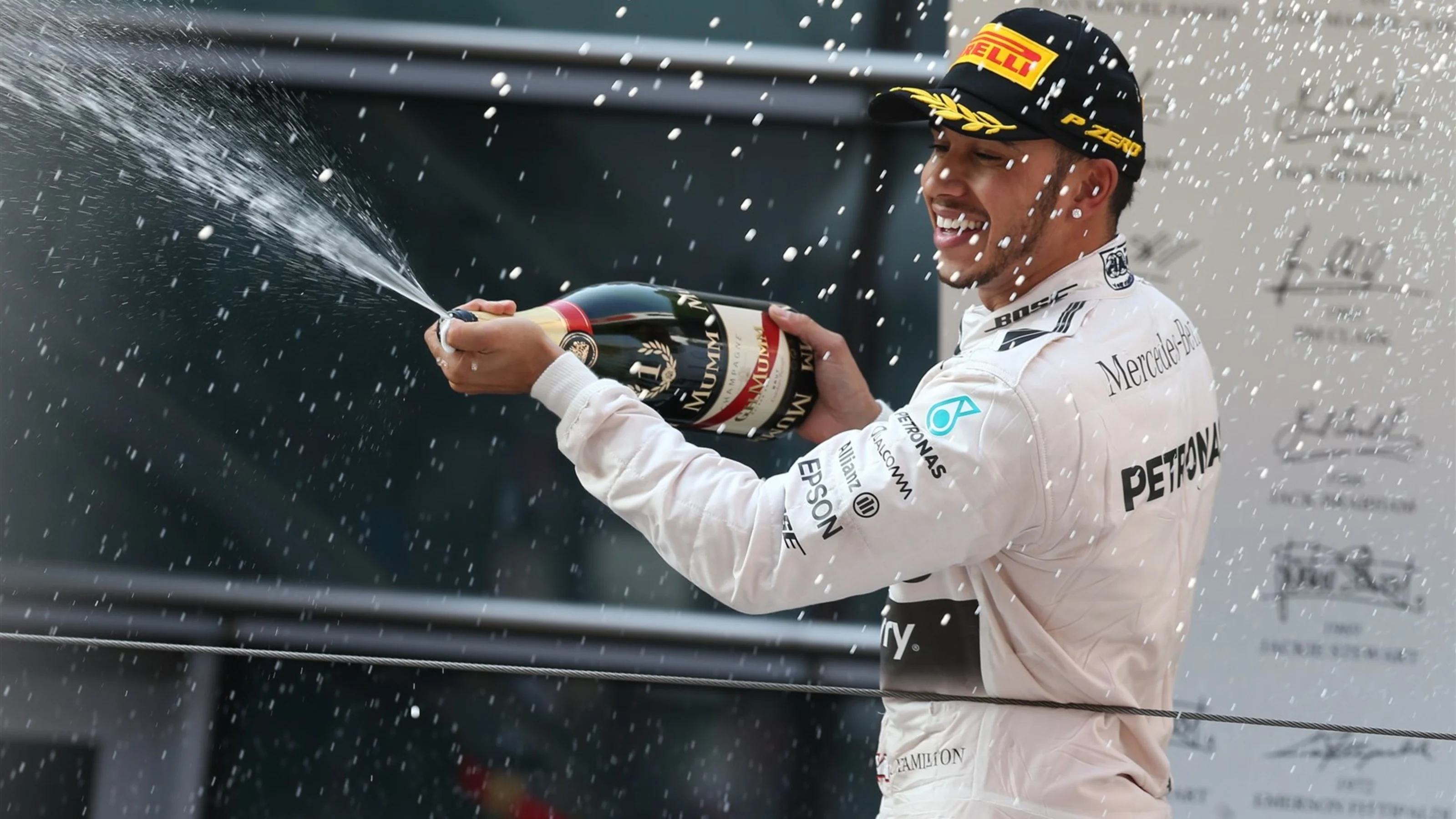 Race winner Lewis Hamilton (GBR) Mercedes AMG F1 celebrates with champagne on the podium at Formula