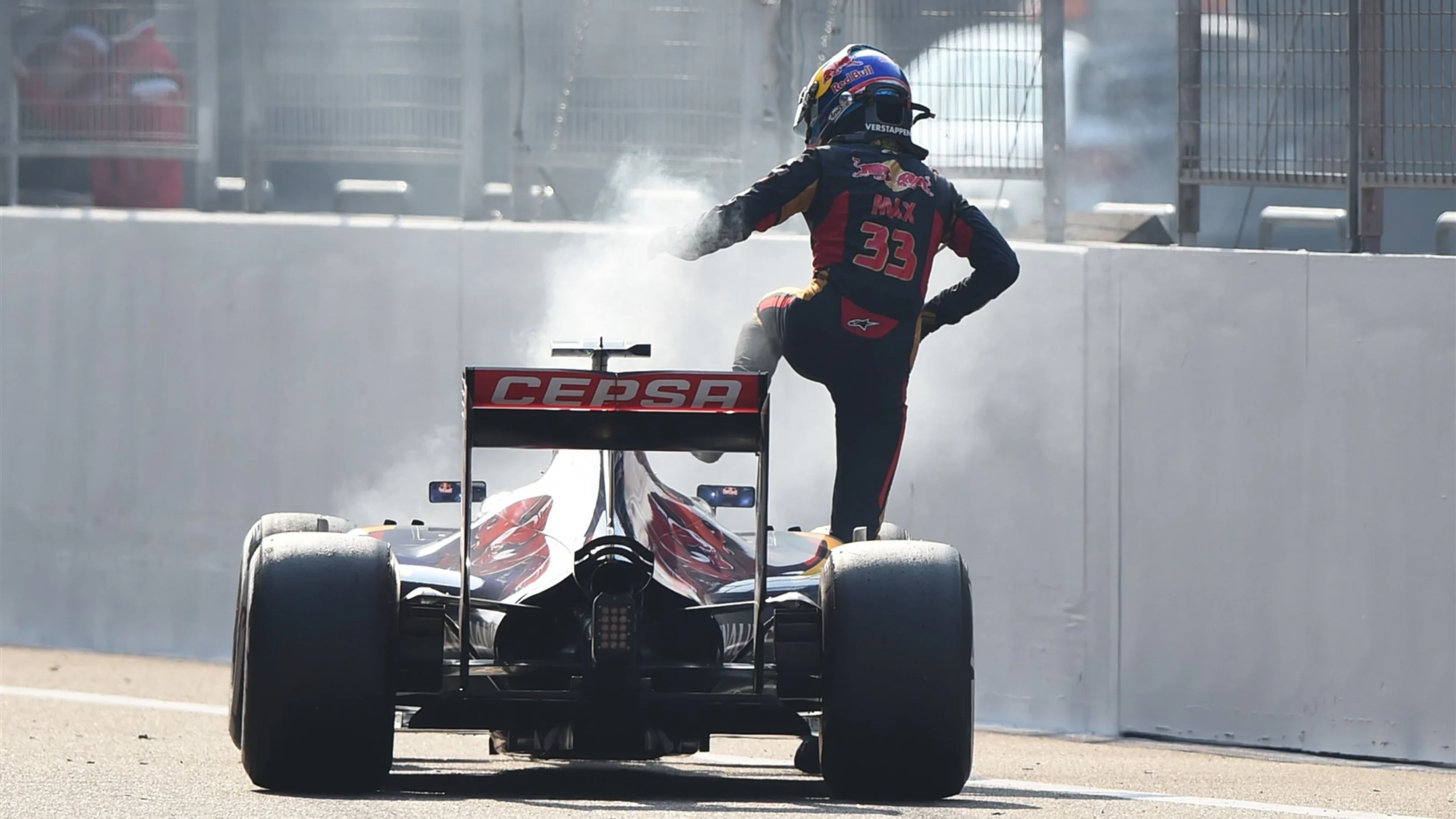 Max Verstappen (NDL) Scuderia Toro Rosso STR10 climbs out of his stricken car after blowing his