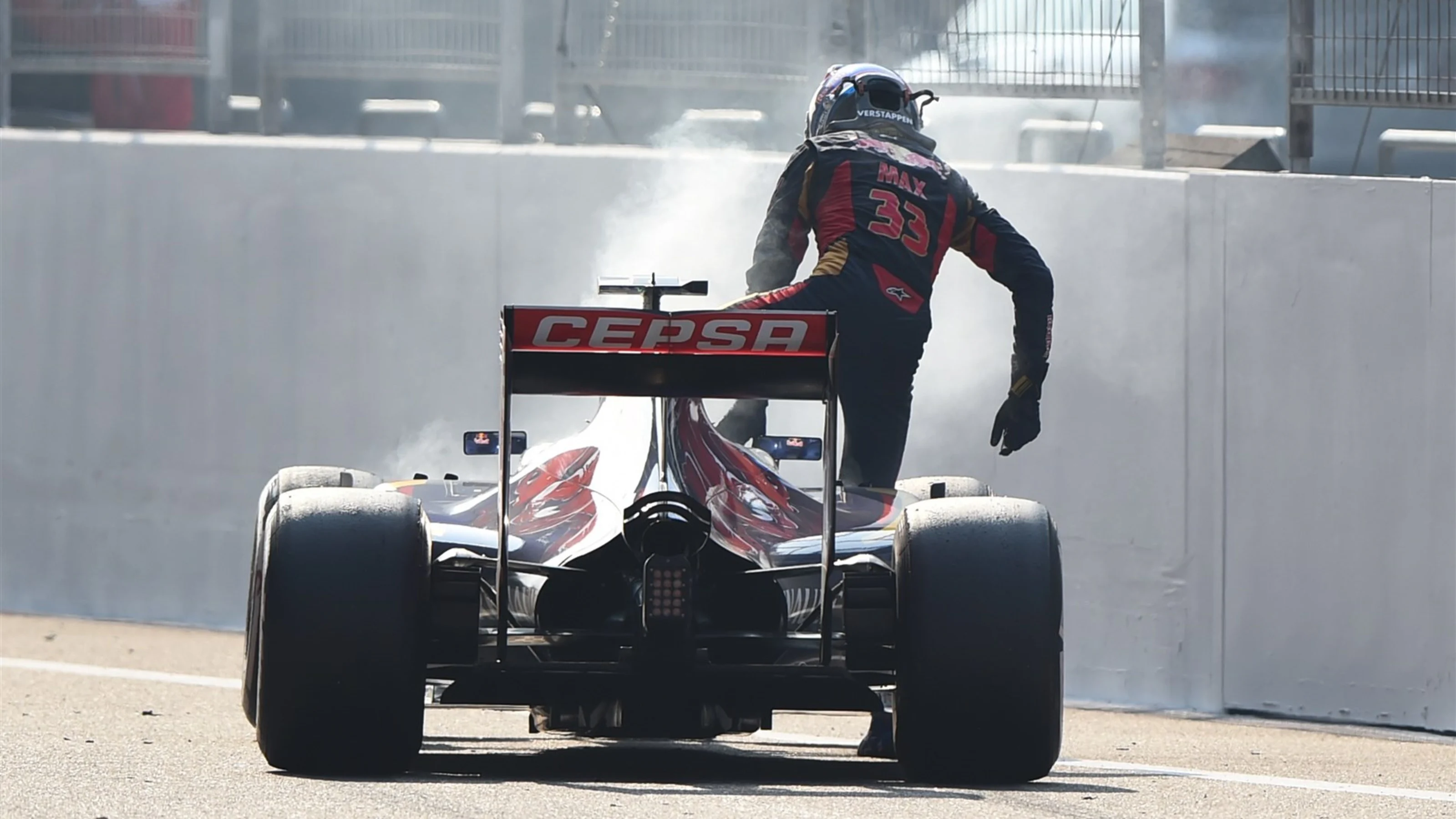 Max Verstappen (NDL) Scuderia Toro Rosso STR10 climbs out of his stricken car after blowing his