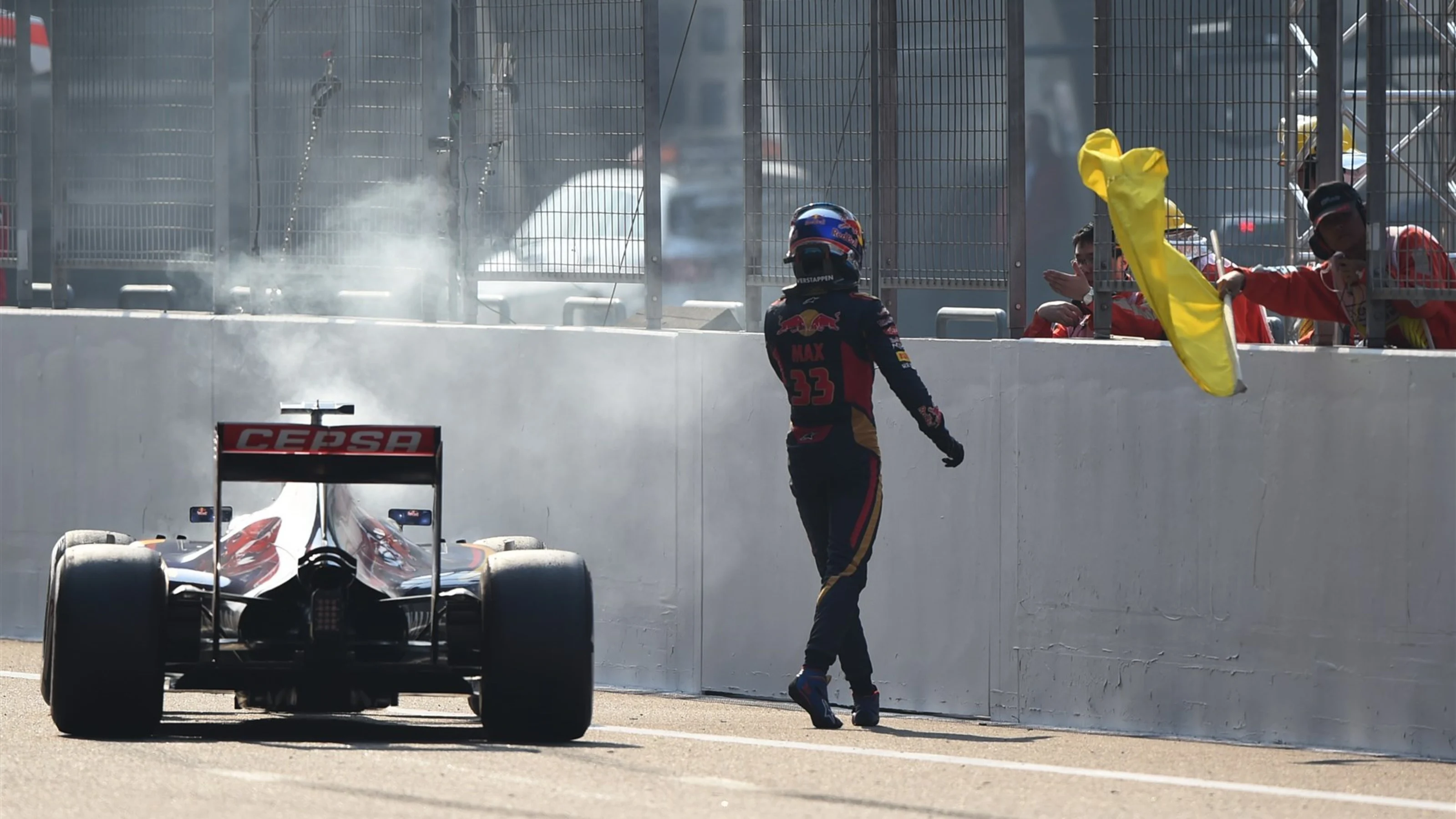 Max Verstappen (NDL) Scuderia Toro Rosso STR10 climbs out of his stricken car after blowing his
