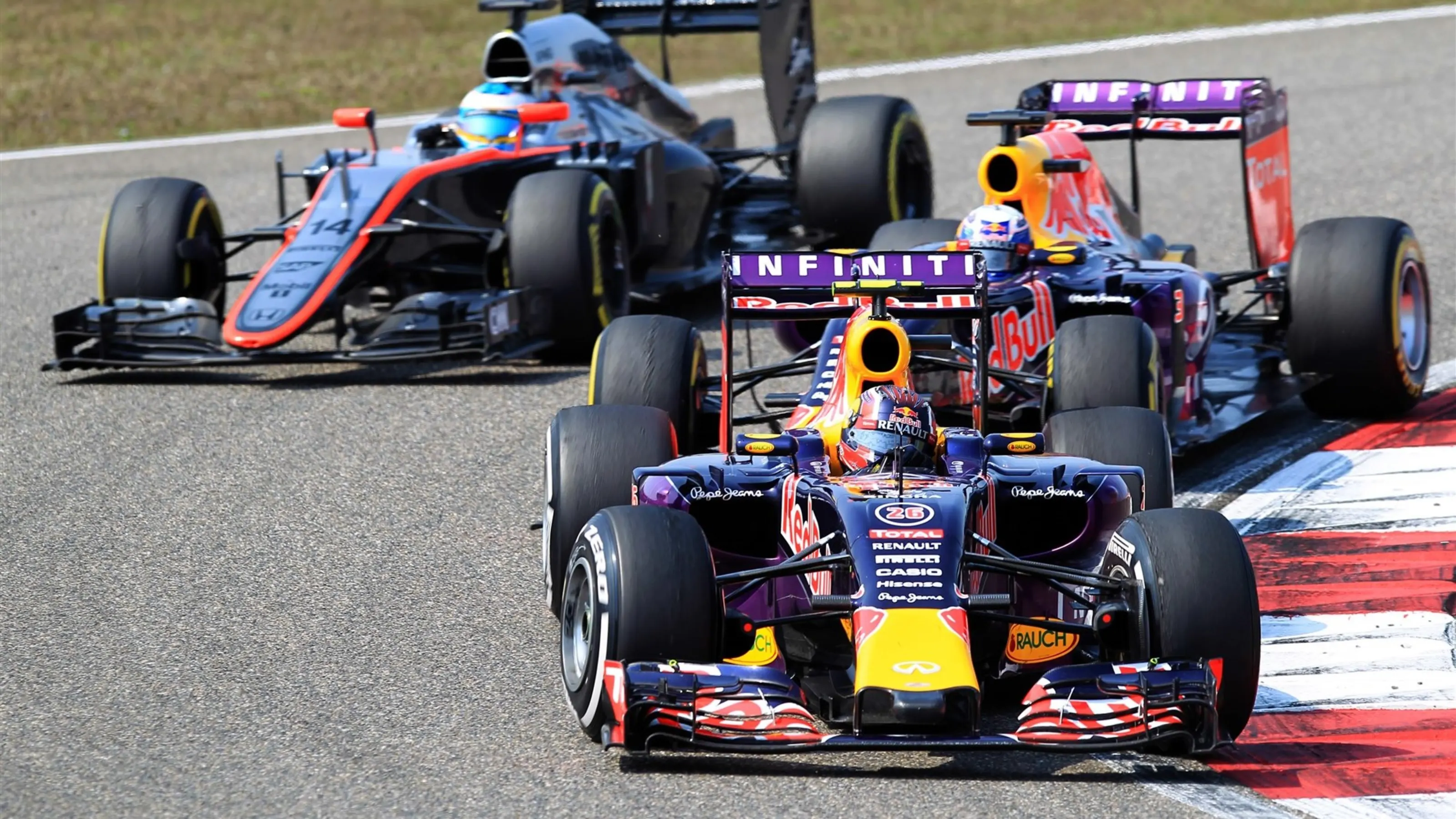 Daniil Kvyat (RUS) Red Bull Racing RB11 leads Daniel Ricciardo (AUS) Red Bull Racing RB11 and