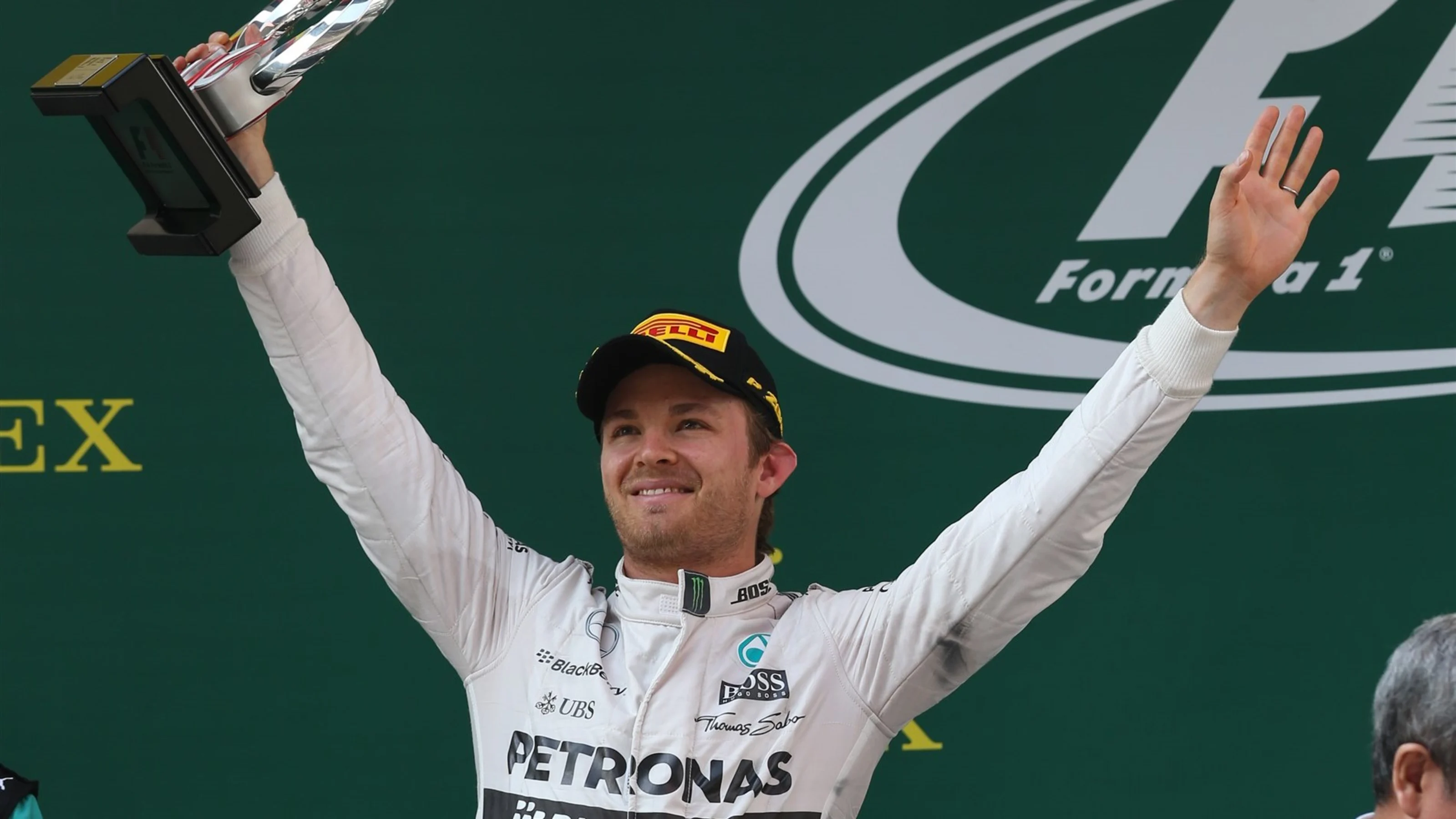 Nico Rosberg (GER) Mercedes AMG F1 celebrates with his trophy on the podium at Formula One World